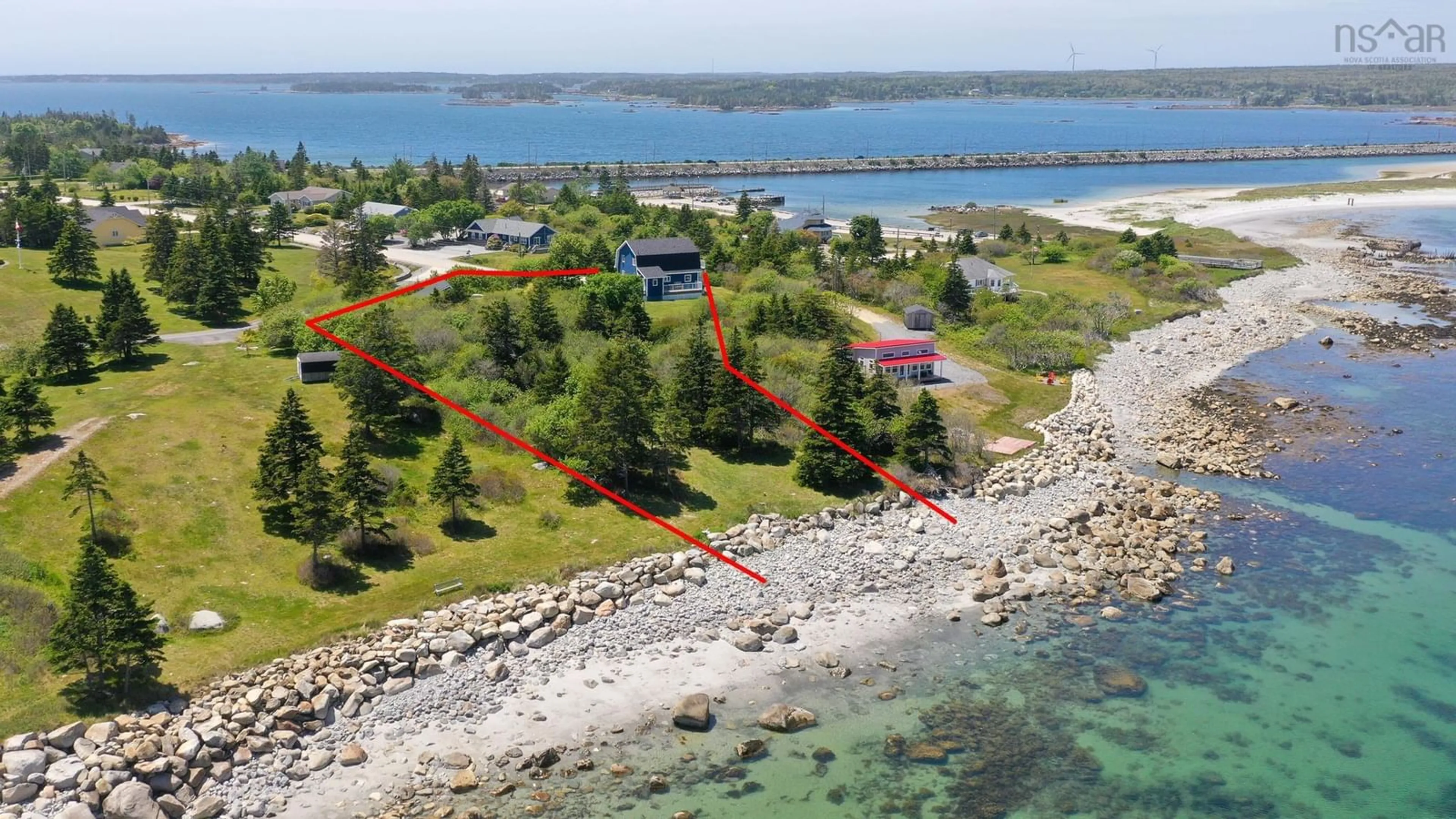 A pic from outside/outdoor area/front of a property/back of a property/a pic from drone, water/lake/river/ocean view for 91 Mcgray Ave, North East Point Nova Scotia B0W 1E0