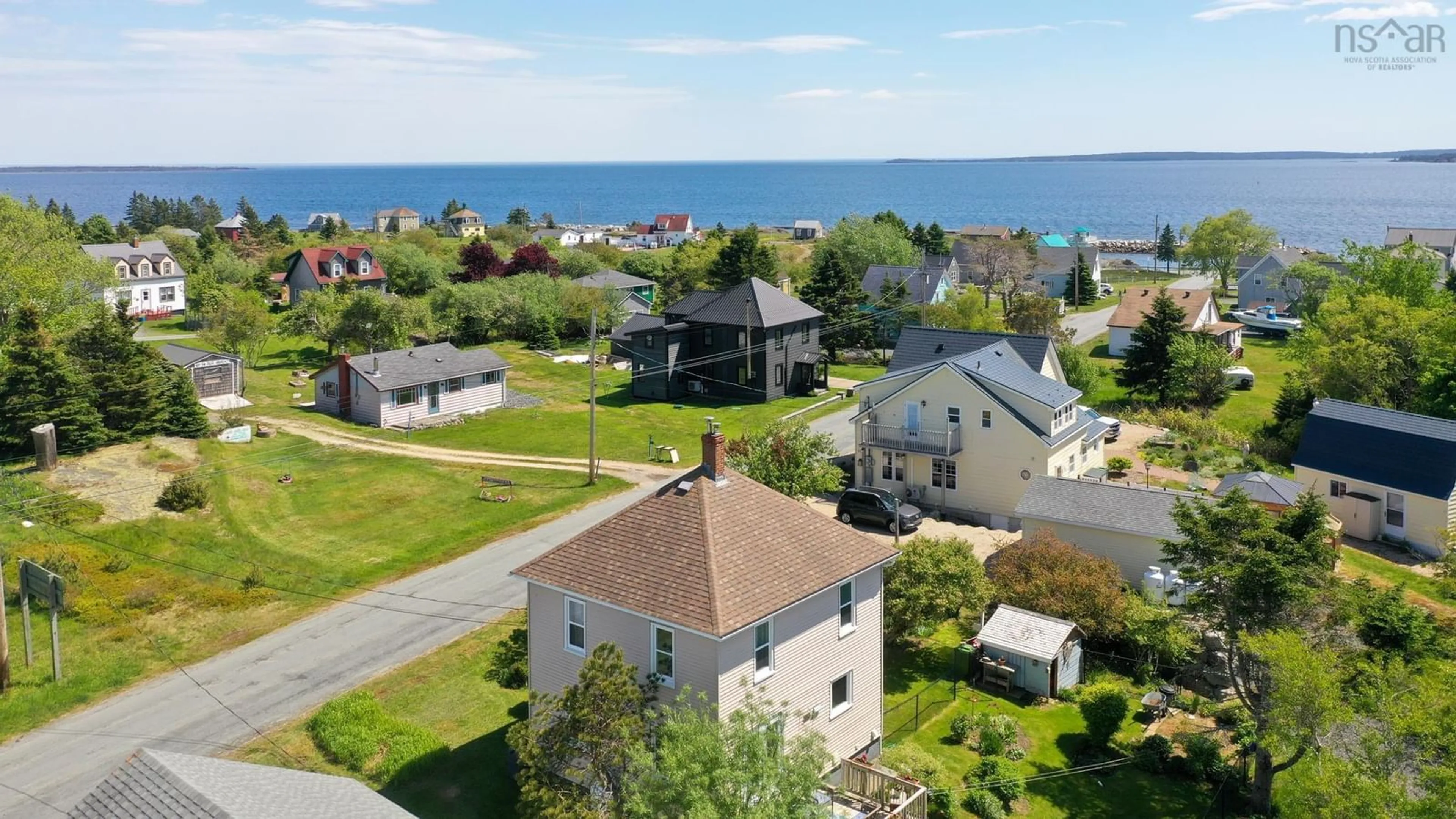 A pic from outside/outdoor area/front of a property/back of a property/a pic from drone, water/lake/river/ocean view for 14 The Lane, Blue Rocks Nova Scotia B0J 2C0