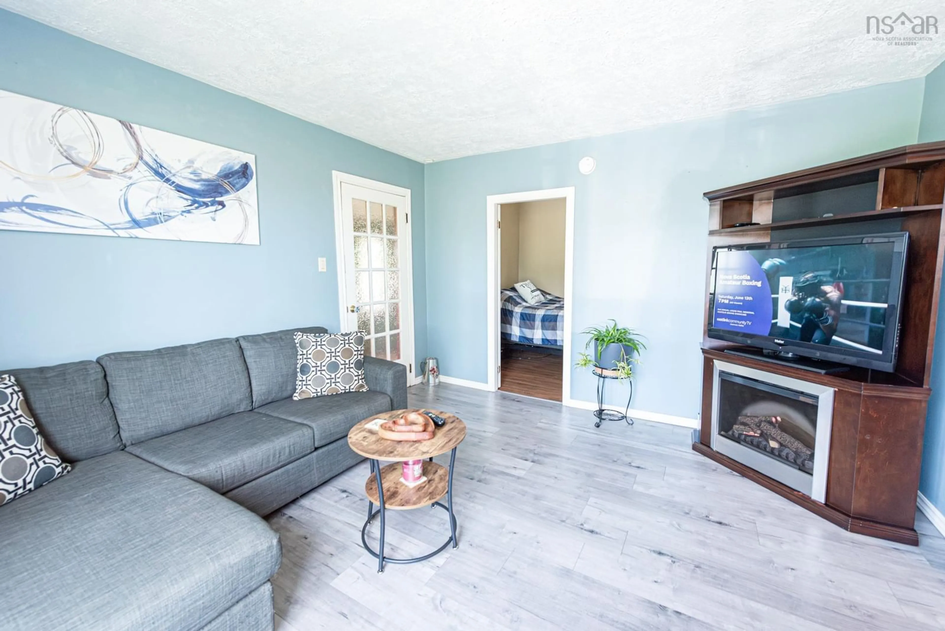 Living room with furniture, wood/laminate floor for 378 Maclellans Brook Rd, Plymouth Nova Scotia B2H 5C5