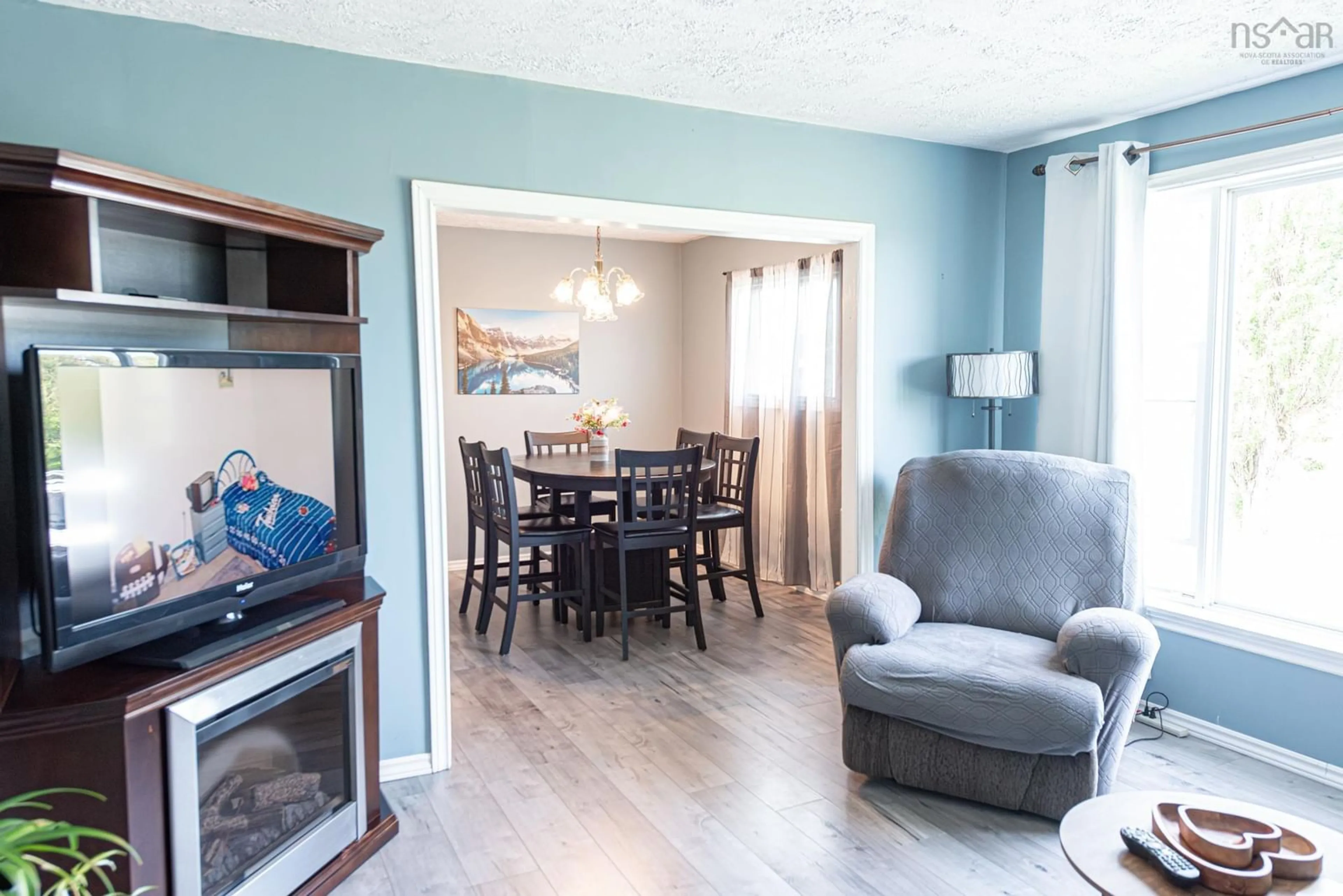 Living room with furniture, wood/laminate floor for 378 Maclellans Brook Rd, Plymouth Nova Scotia B2H 5C5