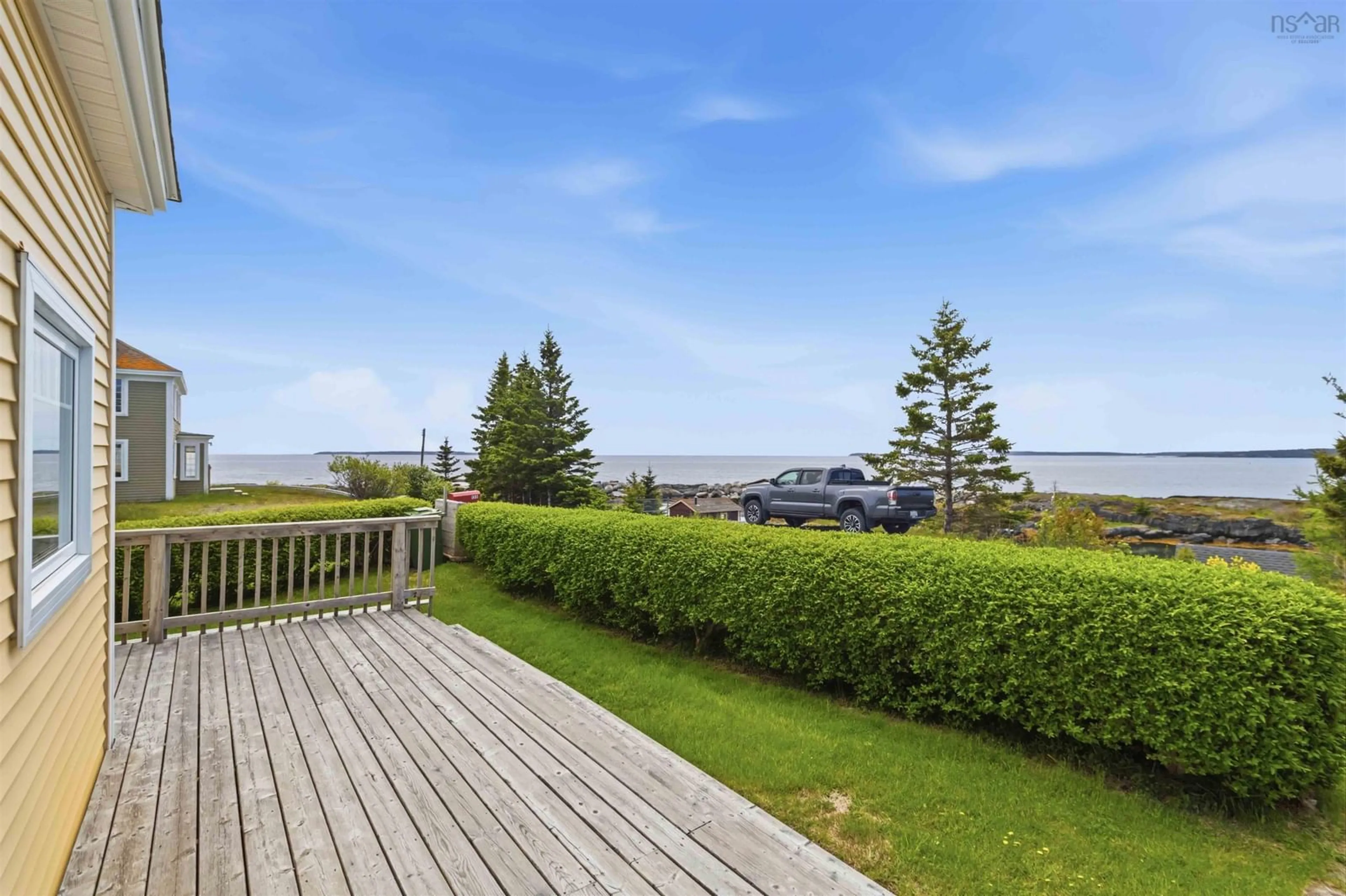 A pic from outside/outdoor area/front of a property/back of a property/a pic from drone, water/lake/river/ocean view for 125 The Point Rd, Blue Rocks Nova Scotia B0J 2C0
