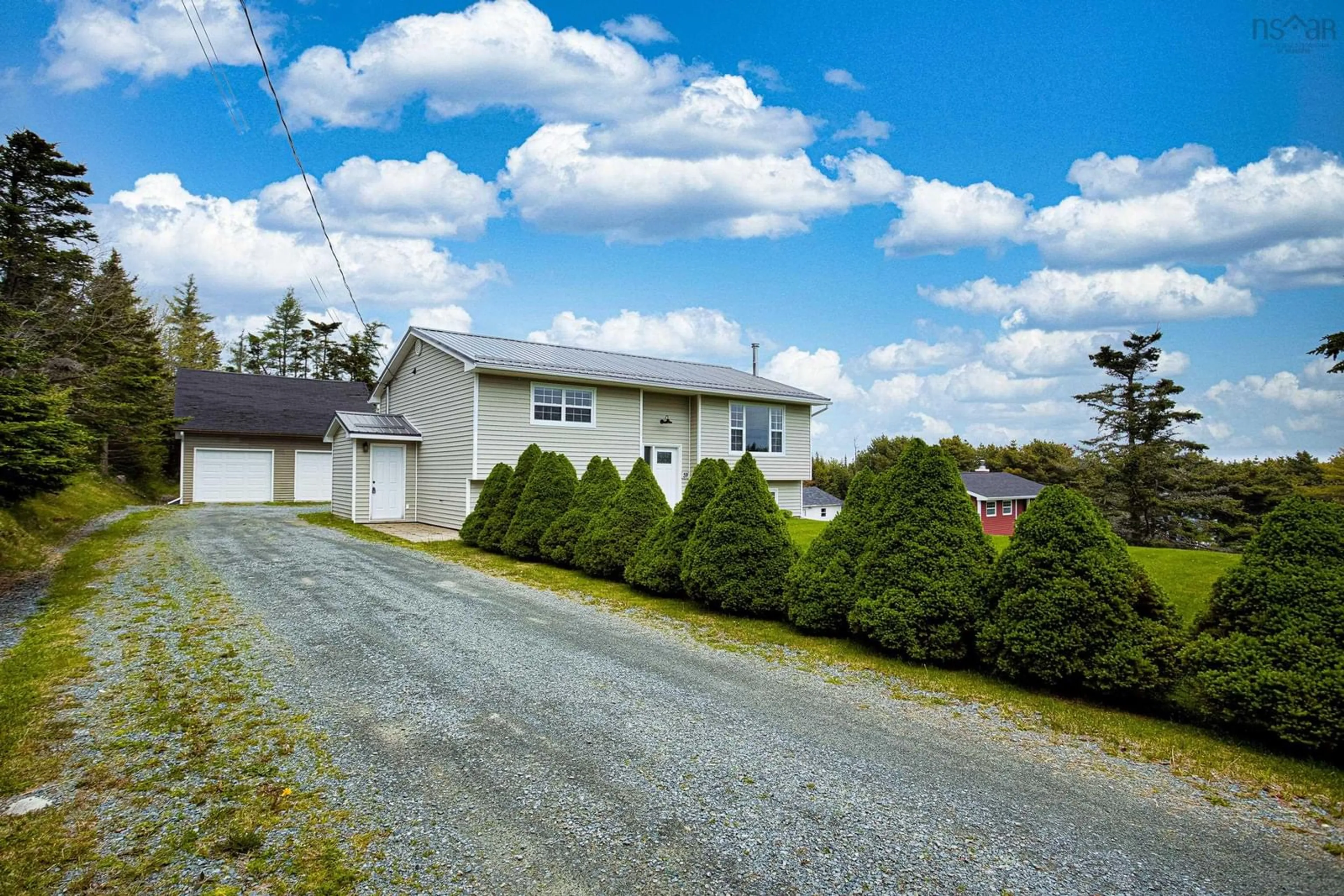 A pic from outside/outdoor area/front of a property/back of a property/a pic from drone, street for 59 Parkwood Dr, East Lawrencetown Nova Scotia B2Z 1P2