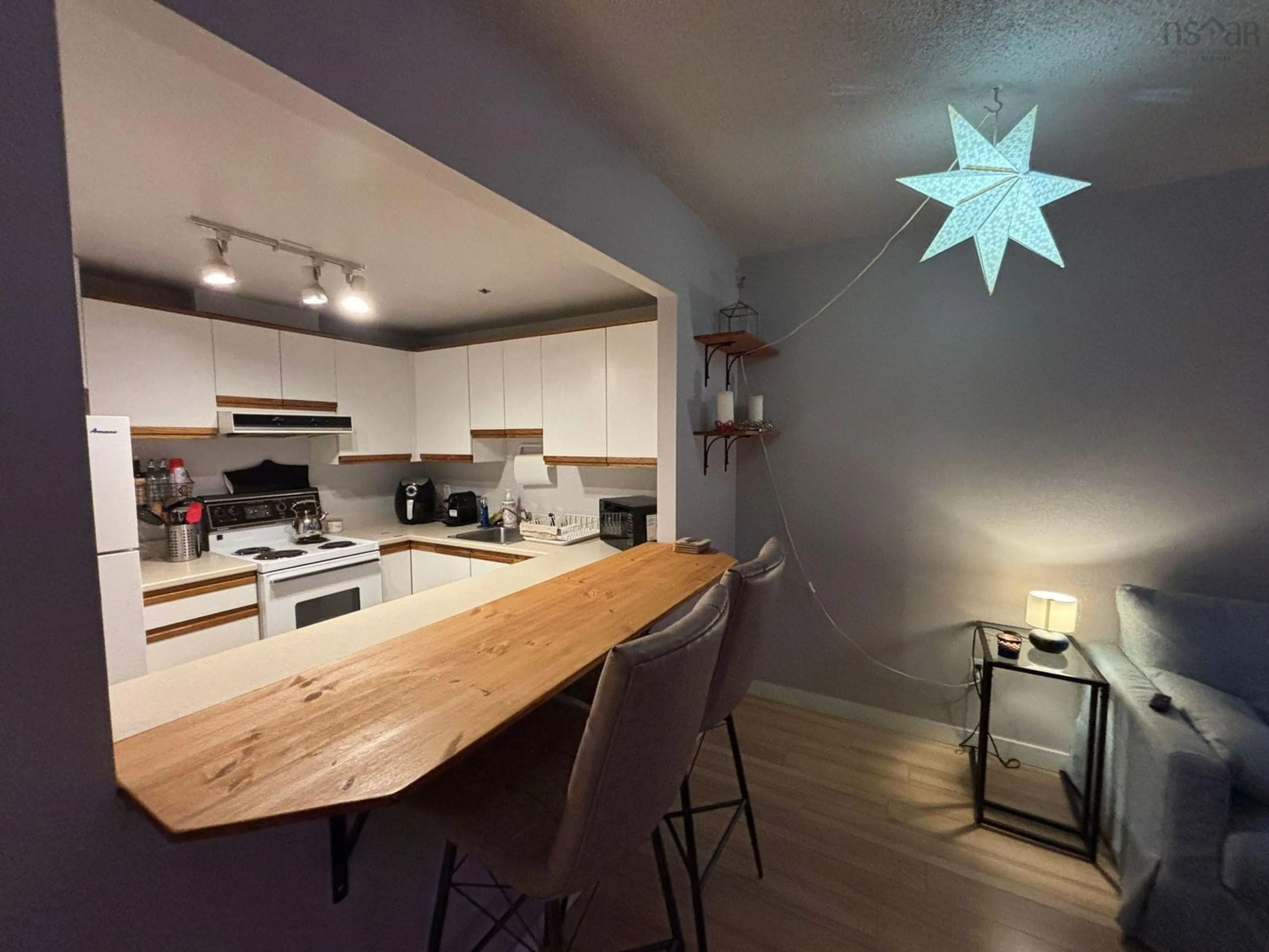 Open concept kitchen, wood/laminate floor for 1326 Lower Water St #521, Halifax Nova Scotia B3J 3R3