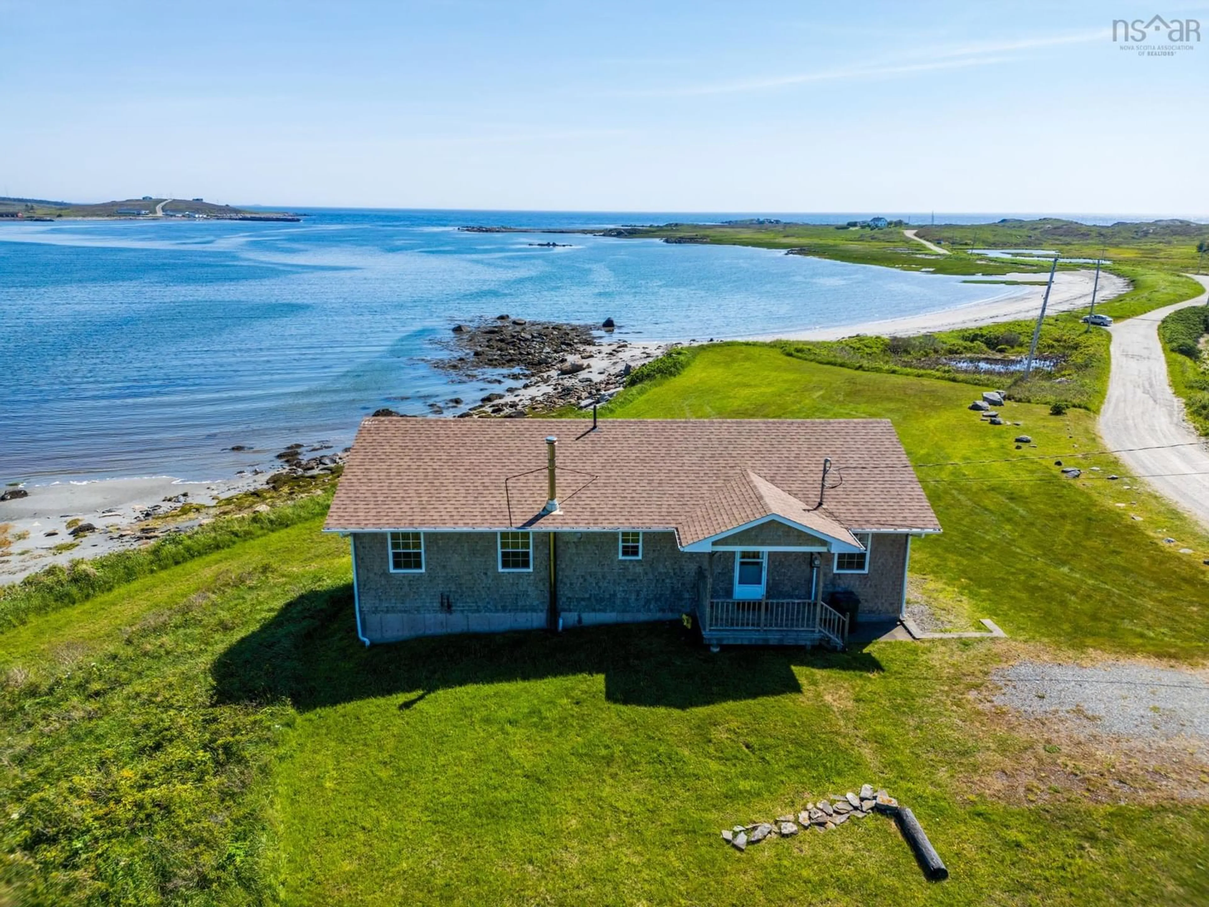 A pic from outside/outdoor area/front of a property/back of a property/a pic from drone, water/lake/river/ocean view for 33 Sunday Point Rd, Kelleys Cove Nova Scotia B5A 5G3