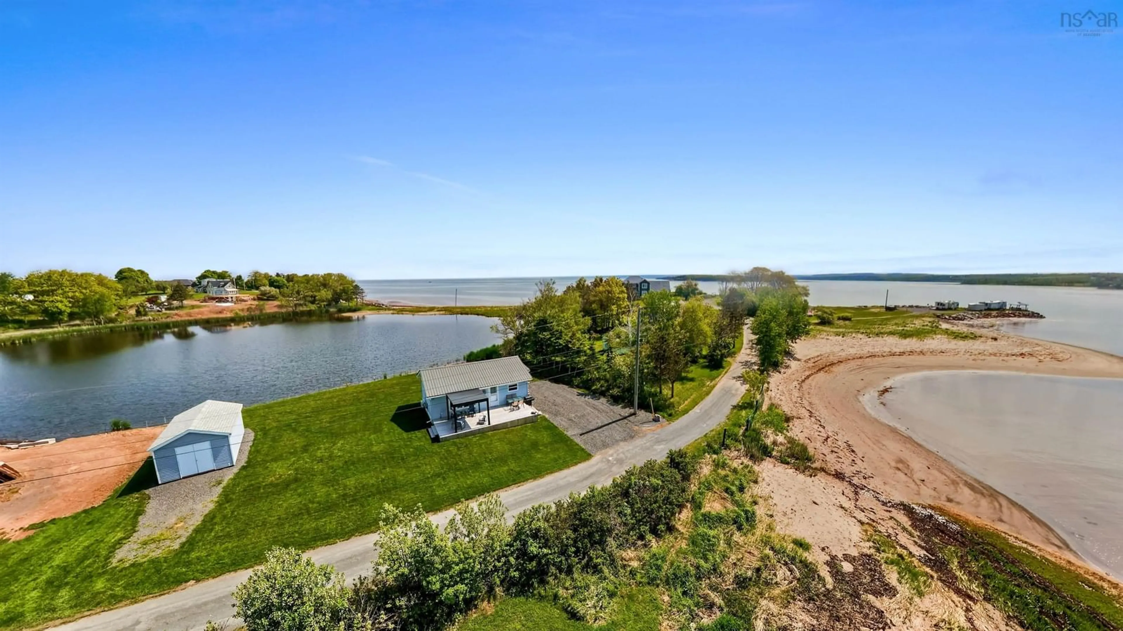 A pic from outside/outdoor area/front of a property/back of a property/a pic from drone, water/lake/river/ocean view for 41 Sand Piper Lane, Black Point Nova Scotia B0K 1X0