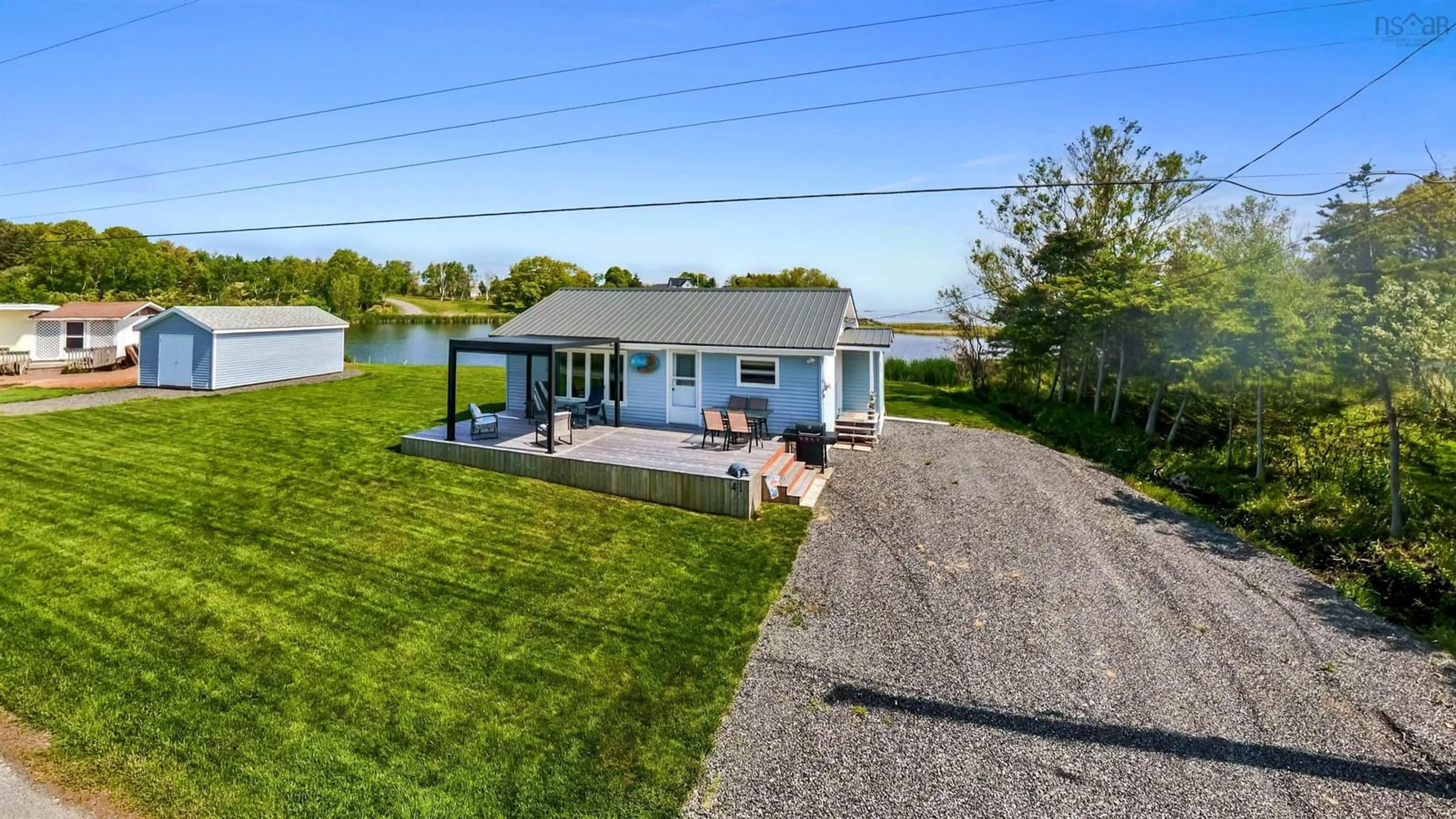 A pic from outside/outdoor area/front of a property/back of a property/a pic from drone, water/lake/river/ocean view for 41 Sand Piper Lane, Black Point Nova Scotia B0K 1X0