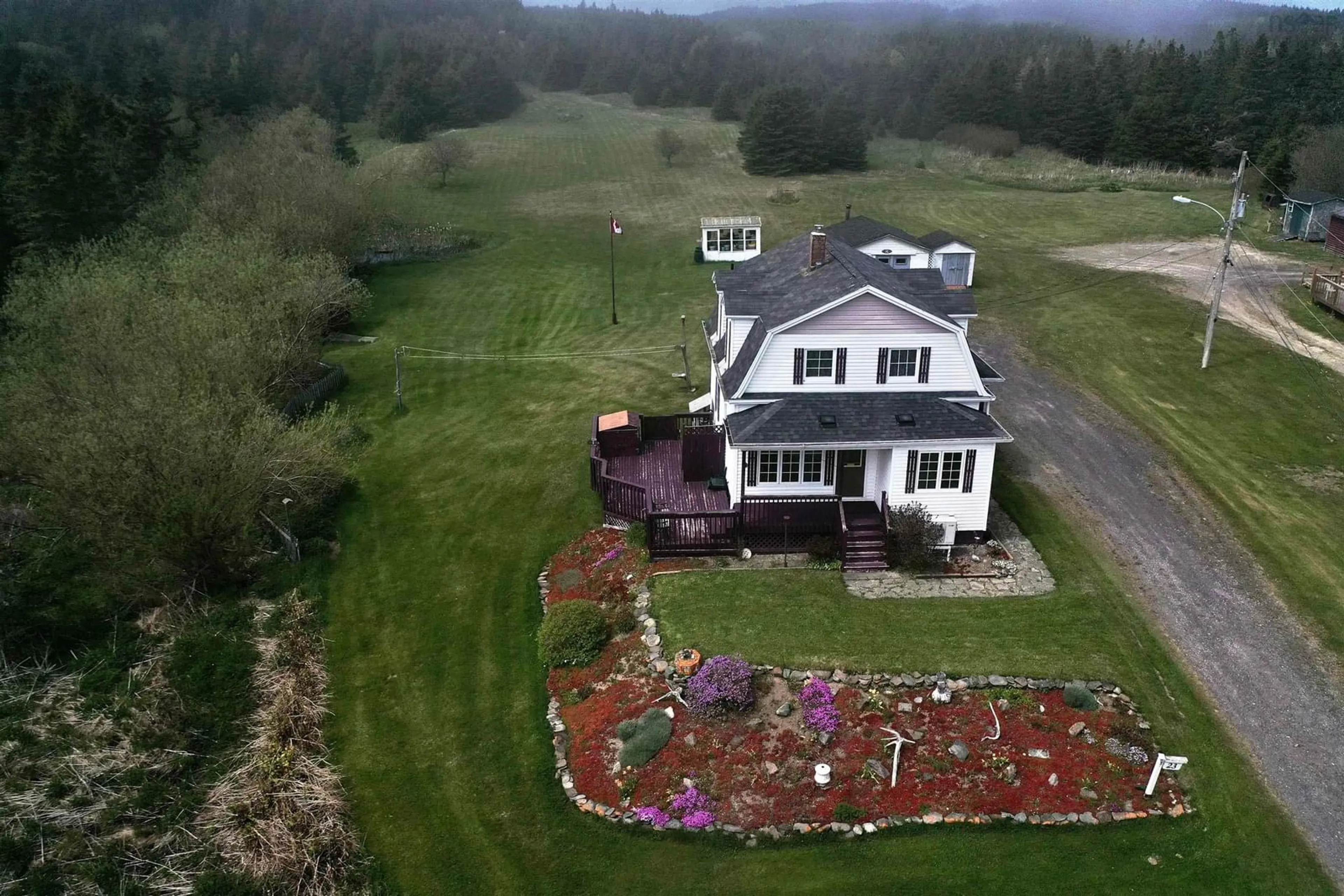 A pic from outside/outdoor area/front of a property/back of a property/a pic from drone, mountain view for 23 Boulet Lane, L'Ardoise Nova Scotia B0E 1S0