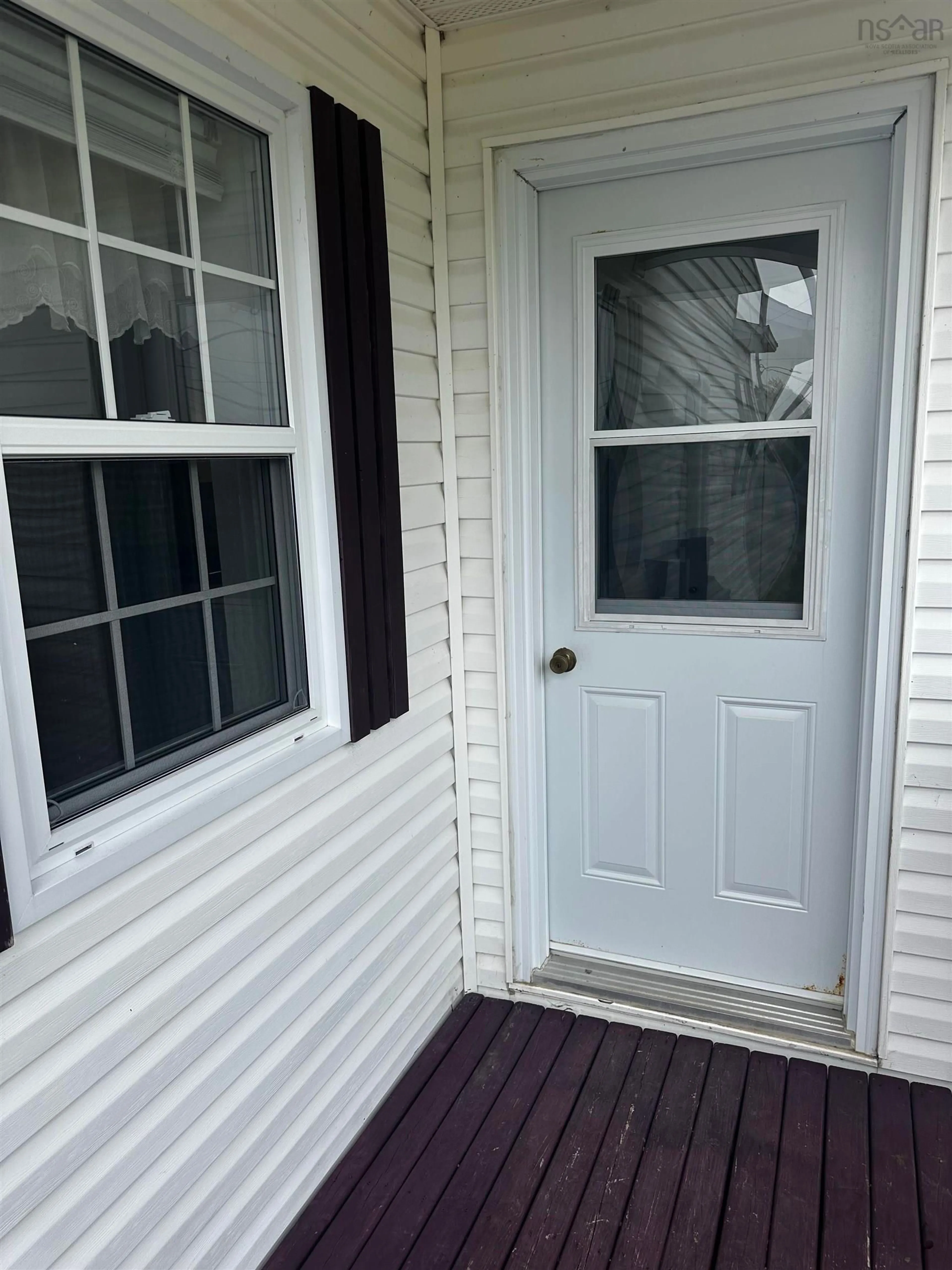 Home with vinyl exterior material, street for 23 Boulet Lane, L'Ardoise Nova Scotia B0E 1S0