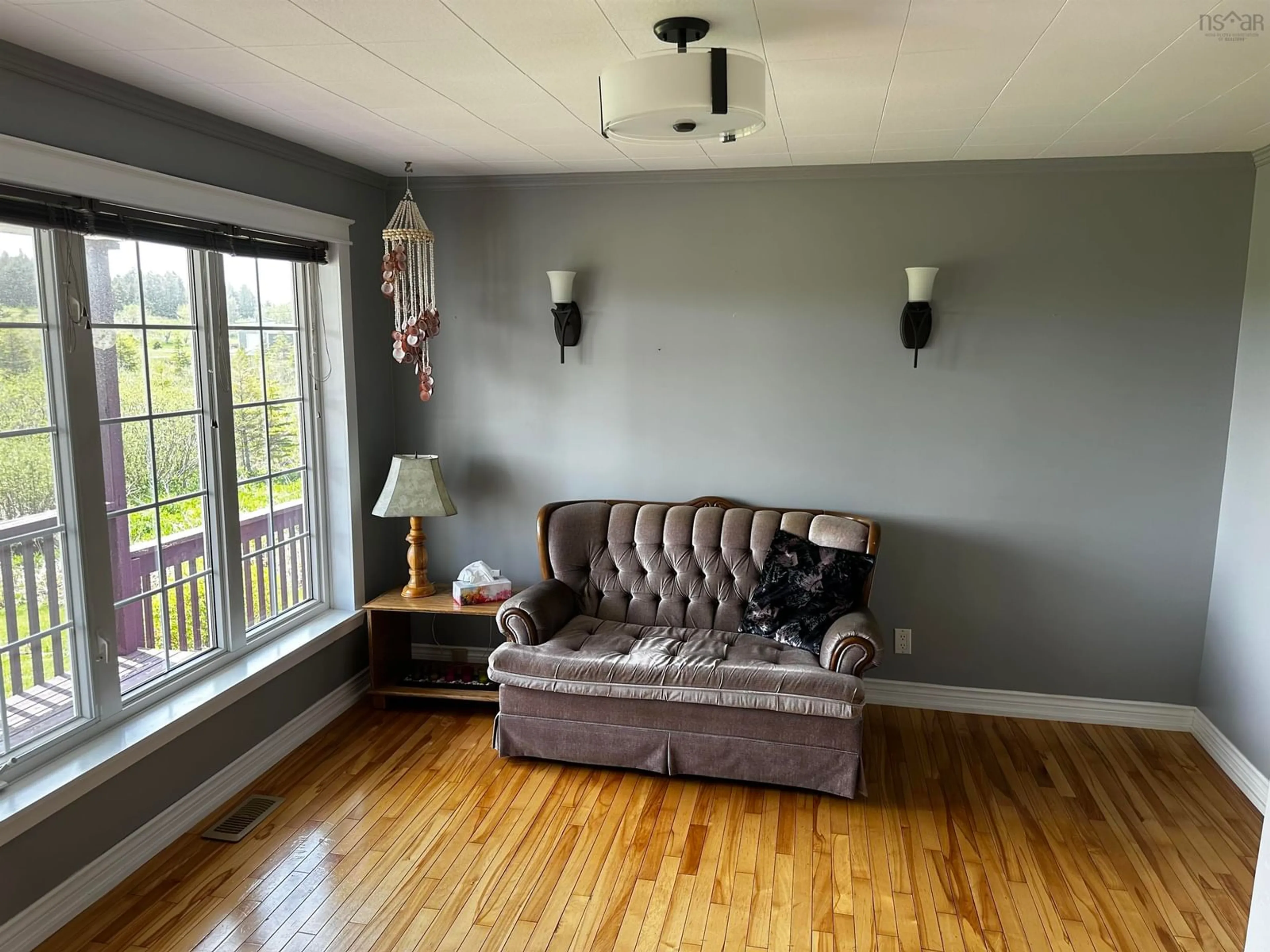 Living room with furniture, wood/laminate floor for 23 Boulet Lane, L'Ardoise Nova Scotia B0E 1S0
