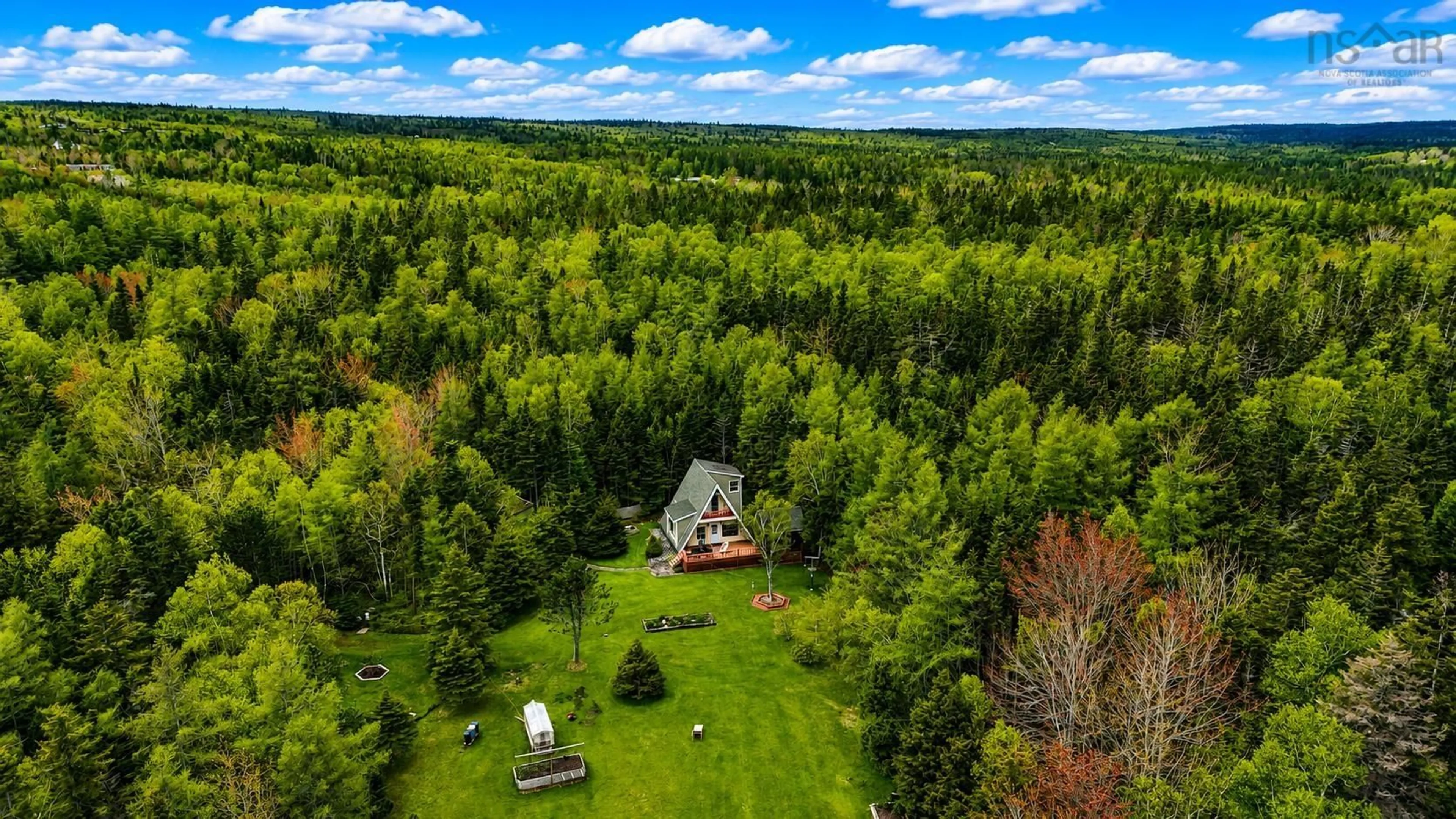 A pic from outside/outdoor area/front of a property/back of a property/a pic from drone, forest/trees view for 1595 West Bay Road, Dundee Nova Scotia B0E 3K0