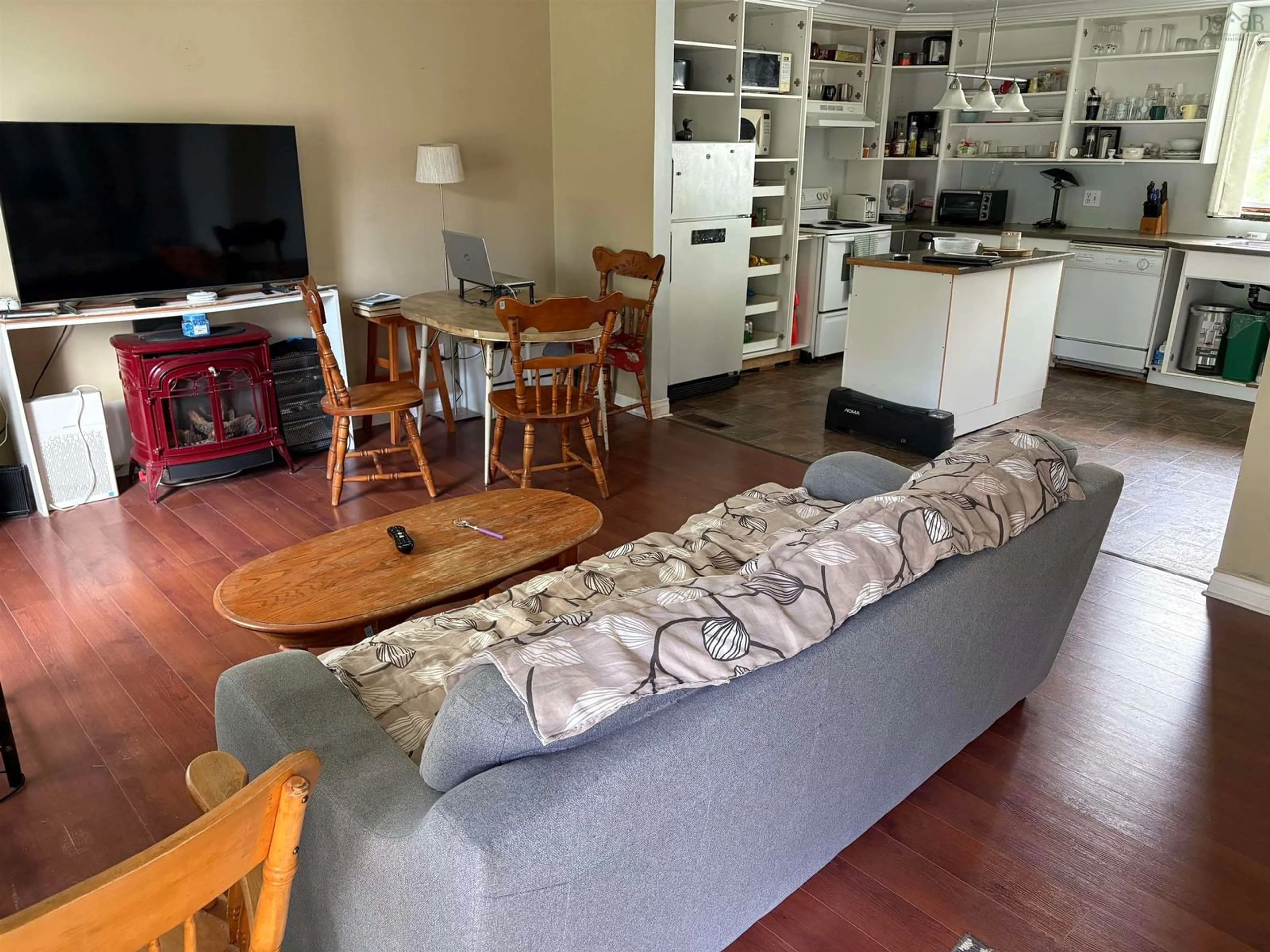 Living room with furniture, wood/laminate floor for 65 Charles St, Amherst Nova Scotia B4H 3P9