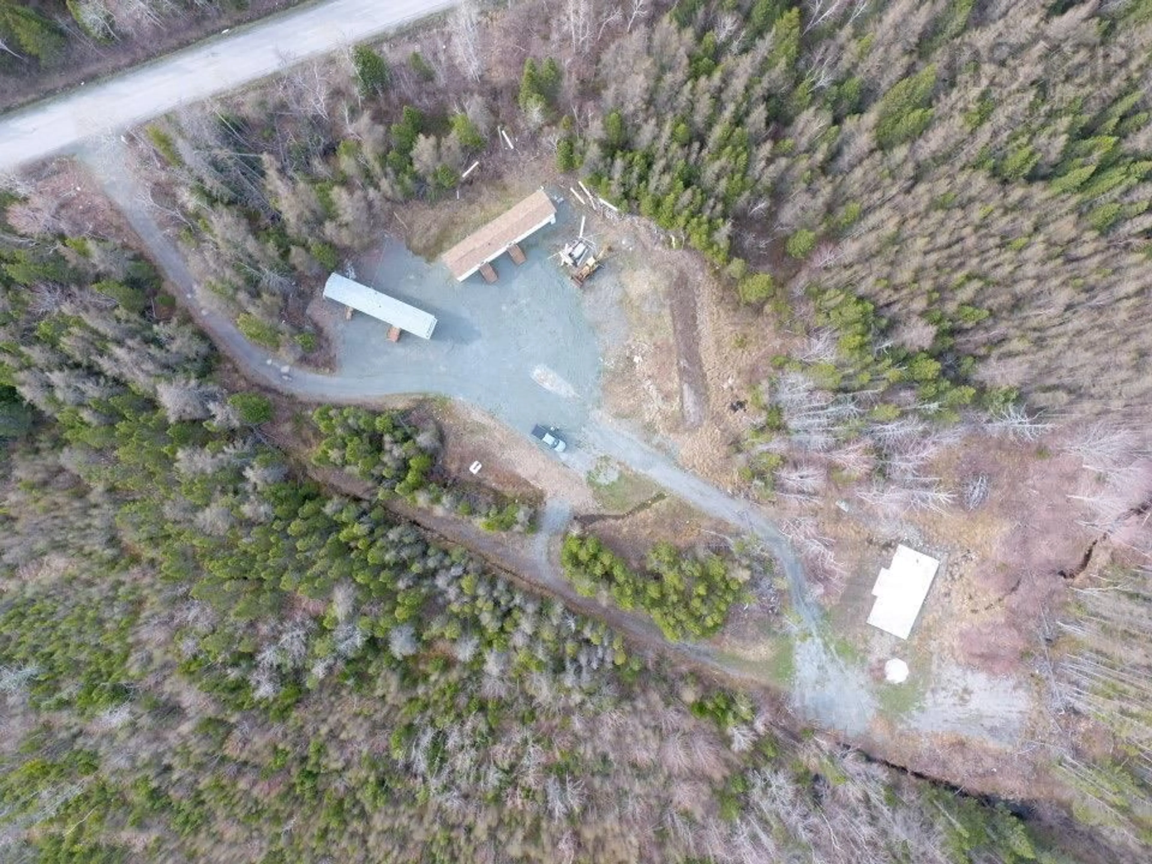 A pic from outside/outdoor area/front of a property/back of a property/a pic from drone, forest/trees view for 1600 Lingan Rd, River Ryan Nova Scotia B1H 5S9