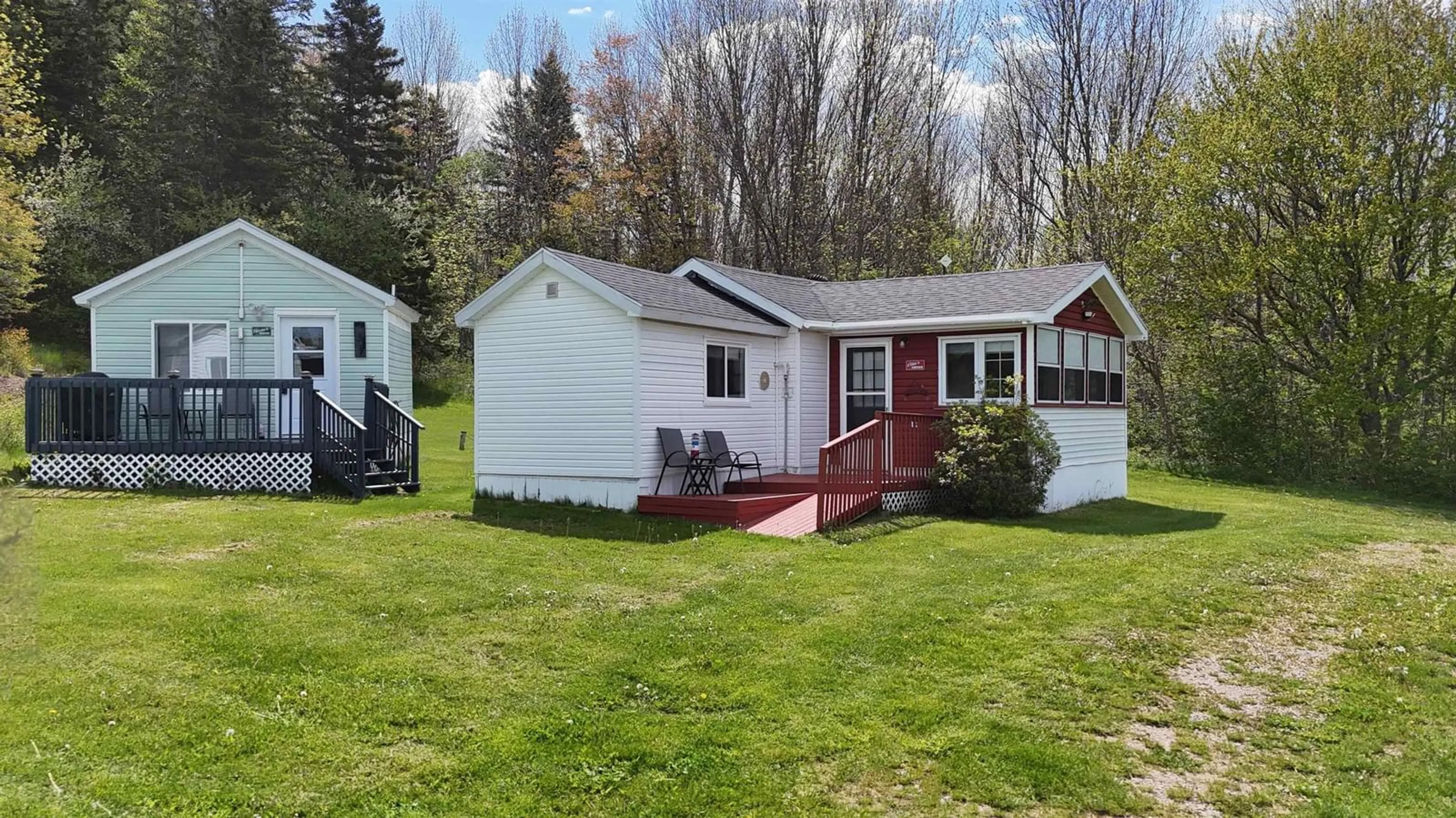 Home with vinyl exterior material, street for 2952 Highway 395, East Lake Ainslie Nova Scotia B0E 3M0