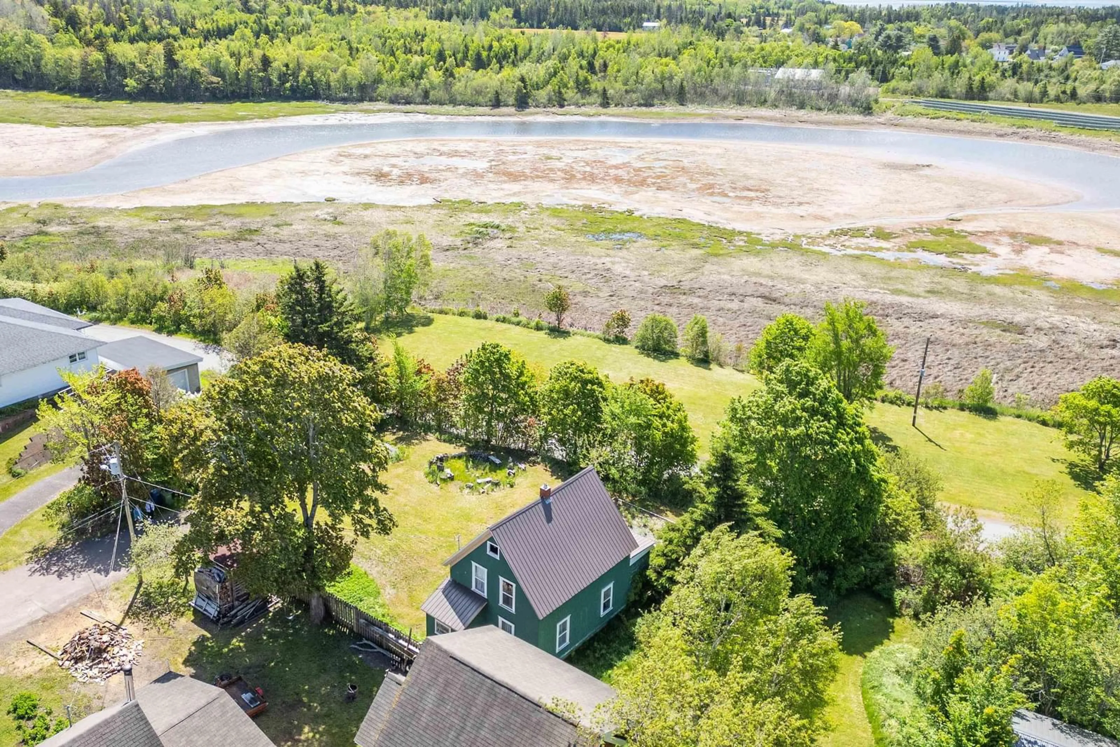 A pic from outside/outdoor area/front of a property/back of a property/a pic from drone, water/lake/river/ocean view for 1 Moore St, Parrsboro Nova Scotia B0M 1S0