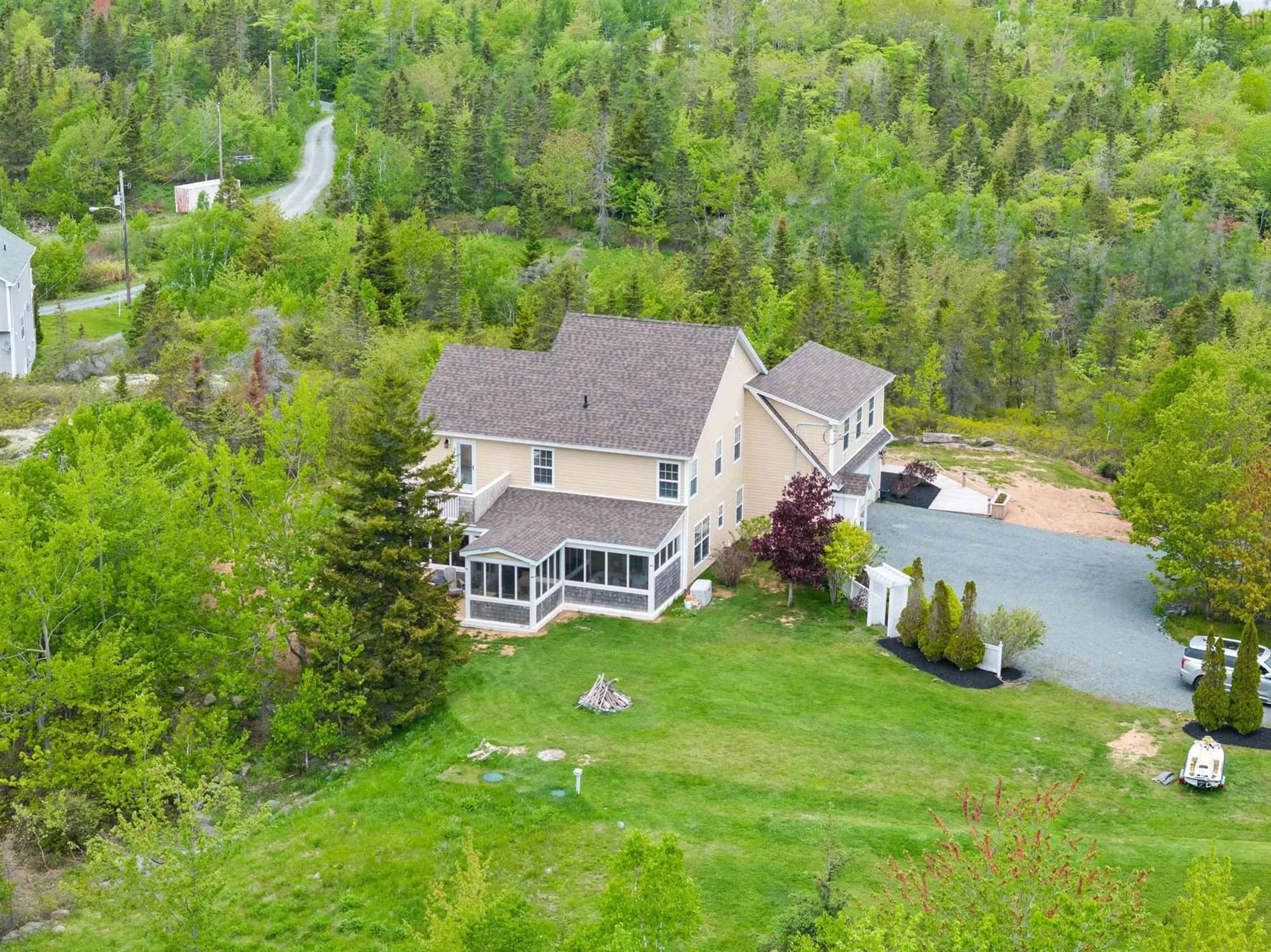 A pic from outside/outdoor area/front of a property/back of a property/a pic from drone, mountain view for 1021 Bissett Rd, Cow Bay Nova Scotia B3G 0A4