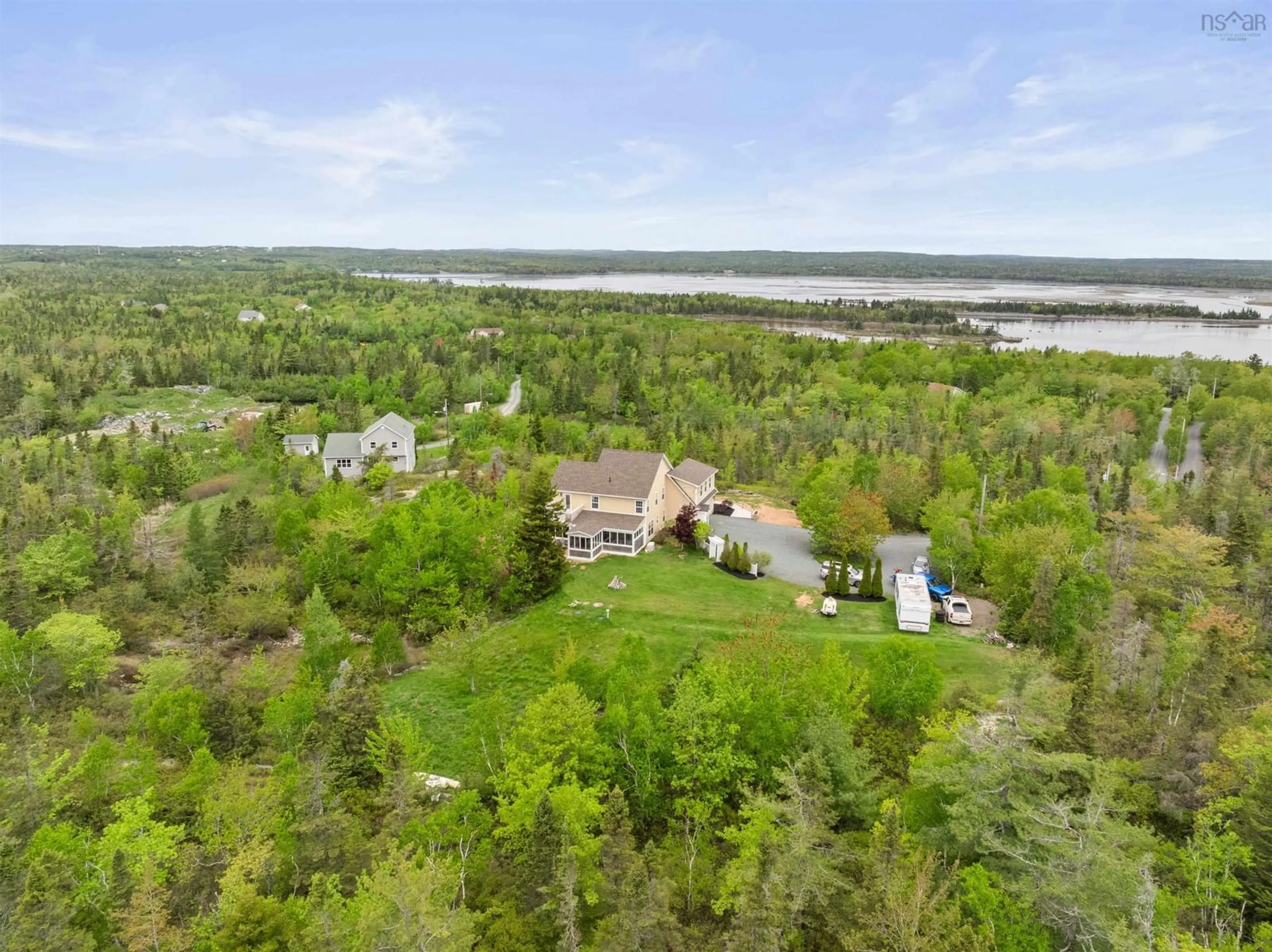 A pic from outside/outdoor area/front of a property/back of a property/a pic from drone, water/lake/river/ocean view for 1021 Bissett Rd, Cow Bay Nova Scotia B3G 0A4