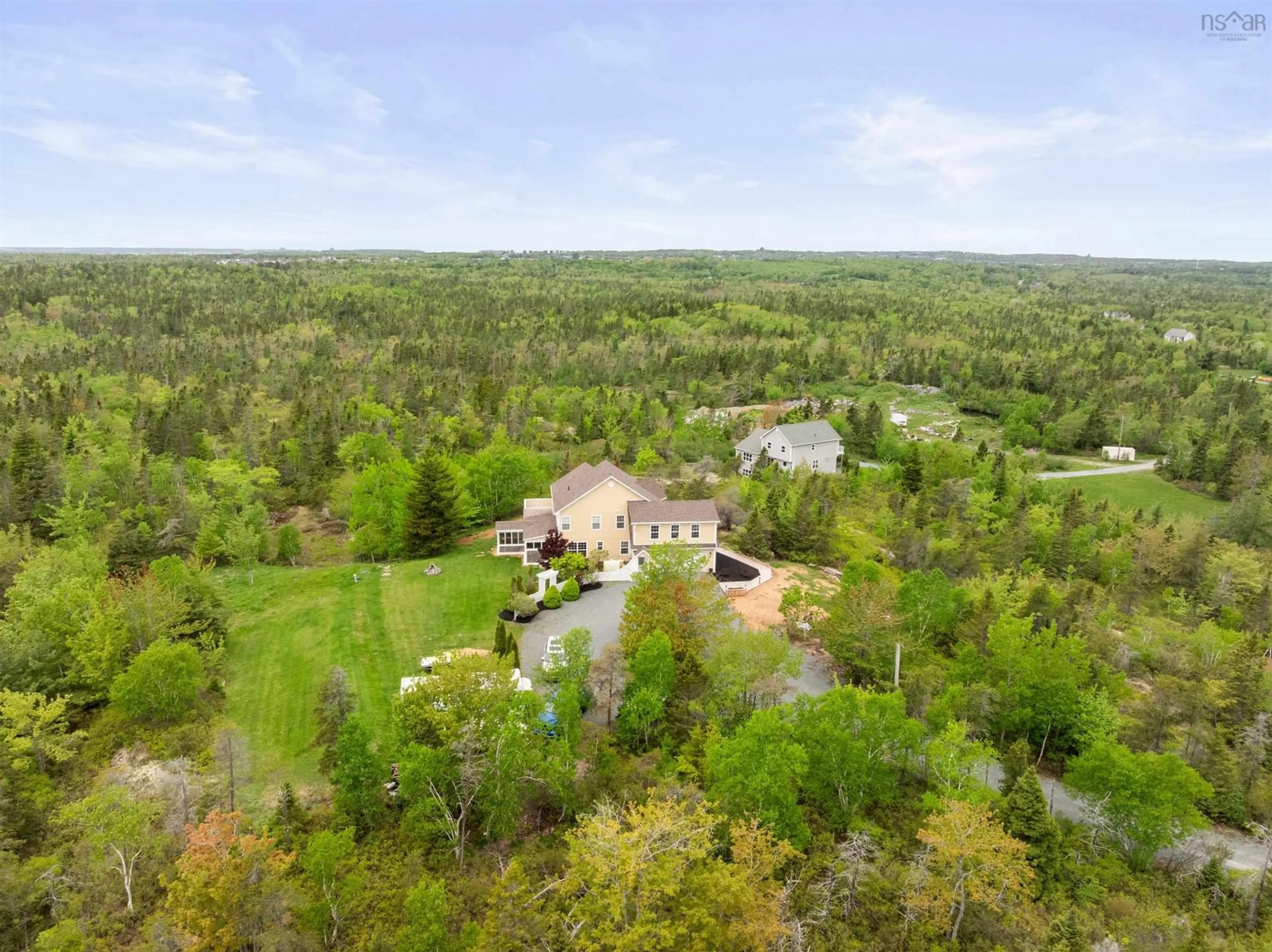 A pic from outside/outdoor area/front of a property/back of a property/a pic from drone, forest/trees view for 1021 Bissett Rd, Cow Bay Nova Scotia B3G 0A4