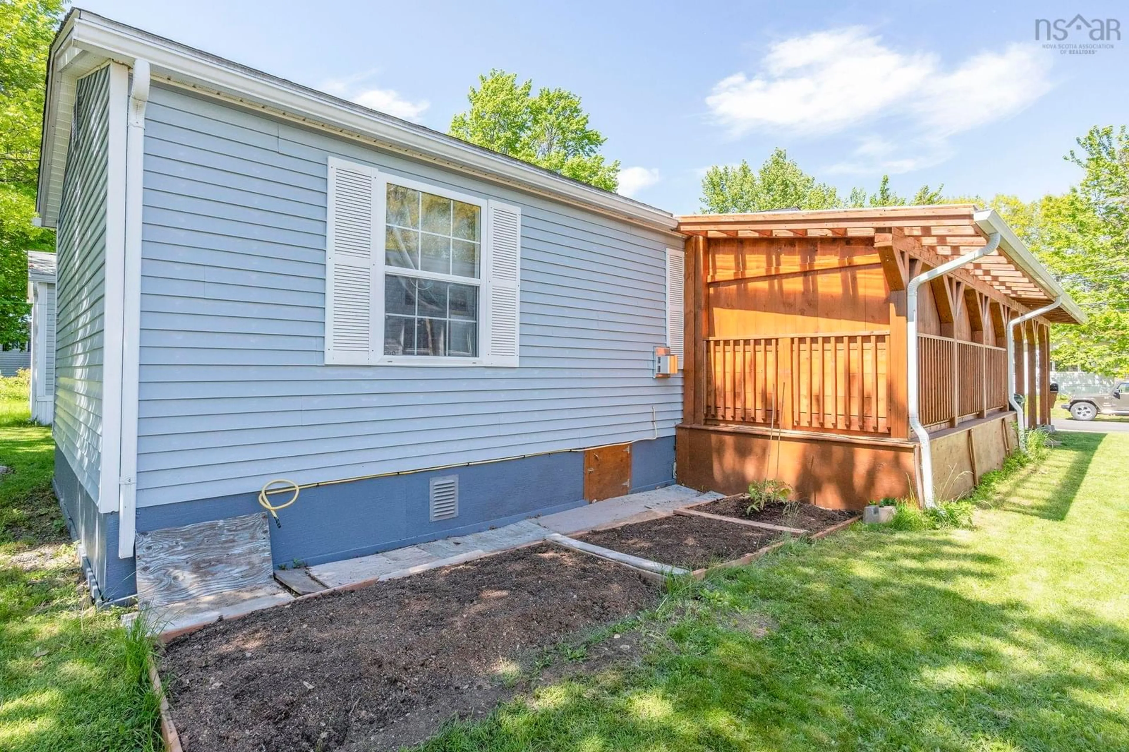 Home with vinyl exterior material, street for 11 Olympic Ave, New Minas Nova Scotia B4N 3T9