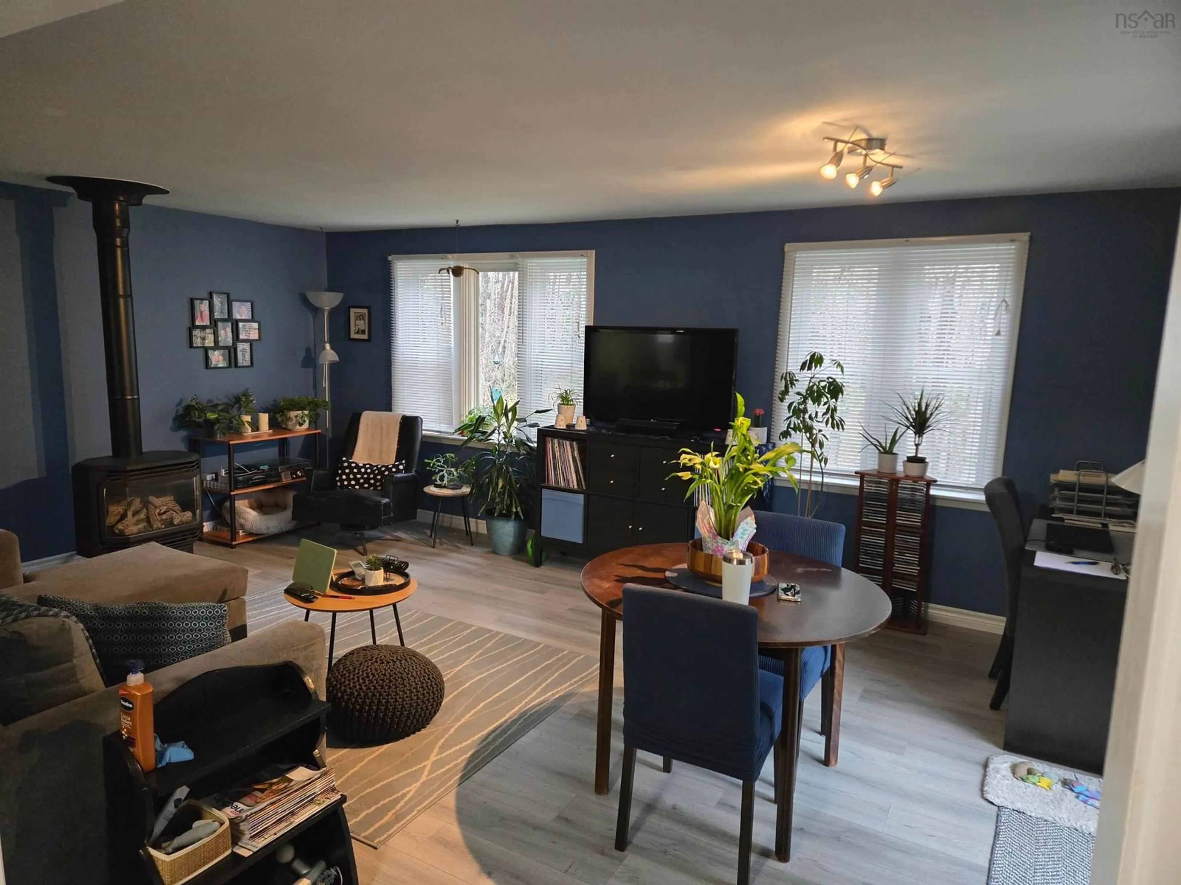 Living room with furniture, wood/laminate floor for 27 Smith Ave, Bridgewater Nova Scotia B4V 1Y2