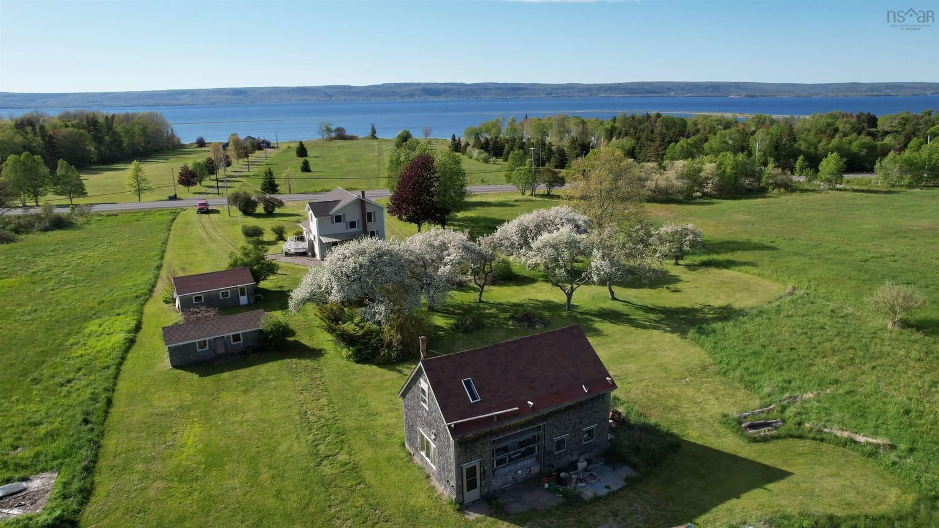 A pic from outside/outdoor area/front of a property/back of a property/a pic from drone, water/lake/river/ocean view for 7903 East Bay Hwy, Big Pond Centre Nova Scotia B1J 1Z3