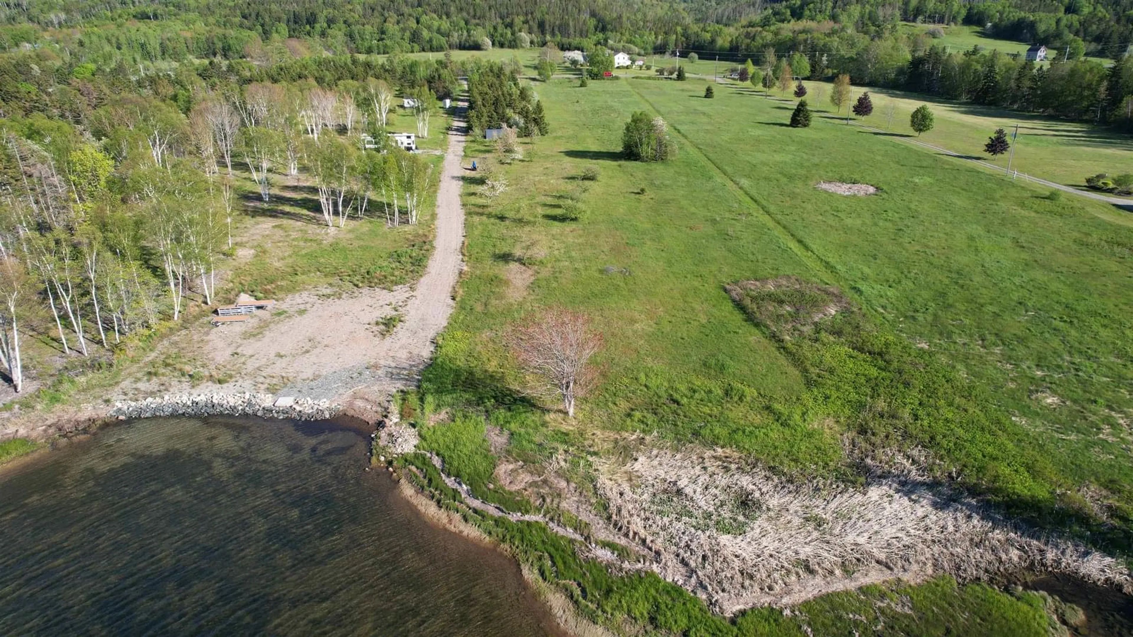 A pic from outside/outdoor area/front of a property/back of a property/a pic from drone, water/lake/river/ocean view for 7903 East Bay Hwy, Big Pond Centre Nova Scotia B1J 1Z3