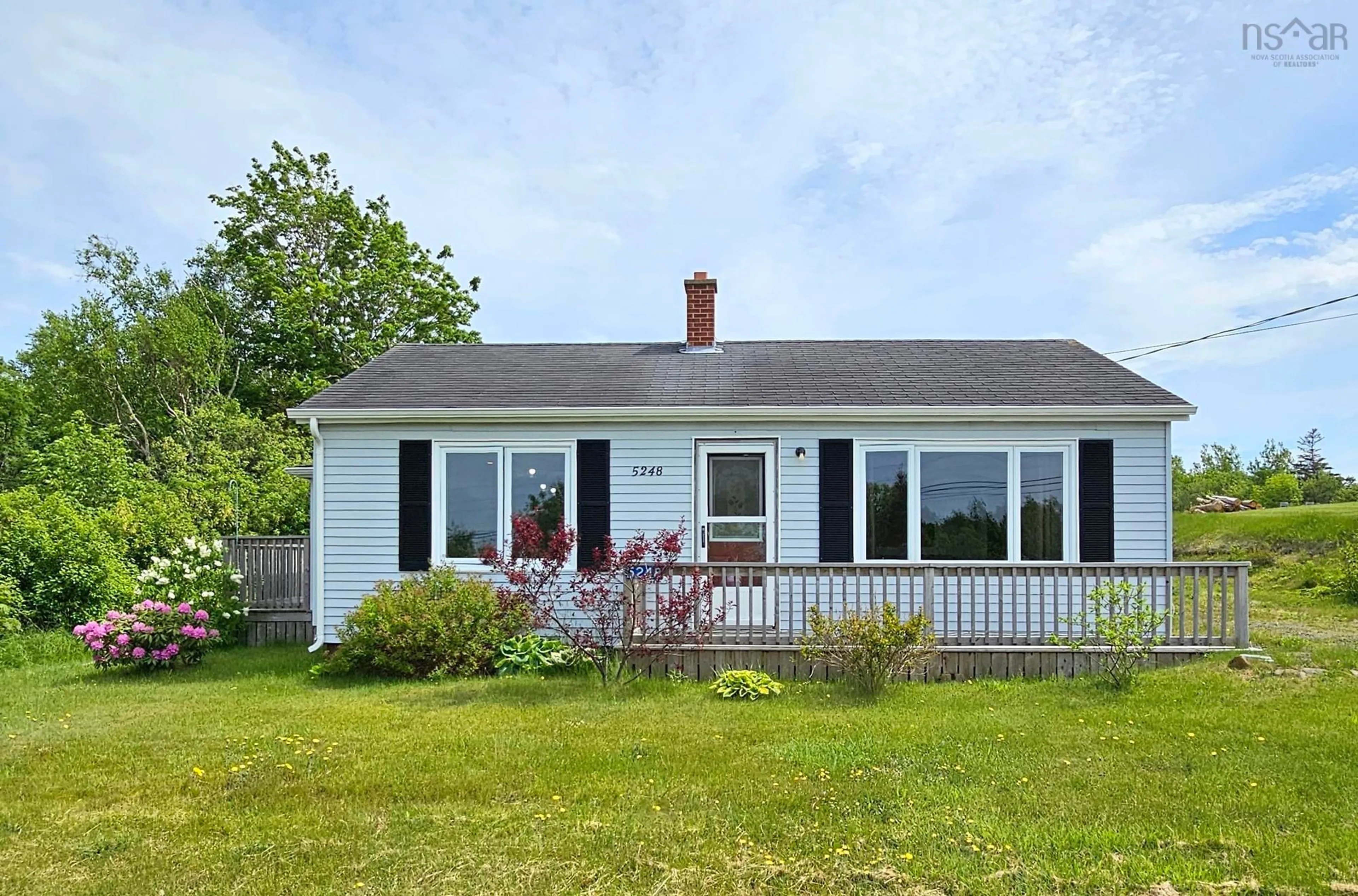 Home with vinyl exterior material, street for 5248 Shore Rd, Parkers Cove Nova Scotia B0S 1A0