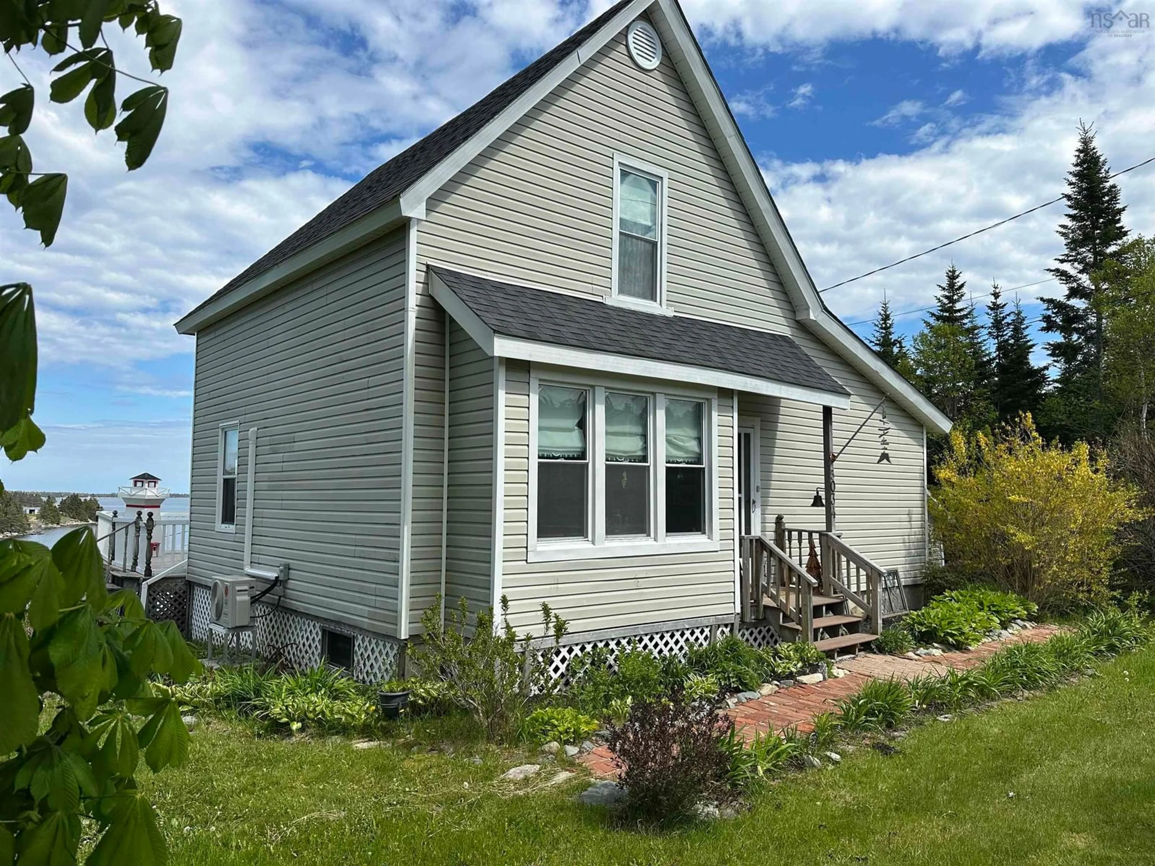 Home with vinyl exterior material, street for 5034 Highway 7, Liscomb Nova Scotia B0J 2A0