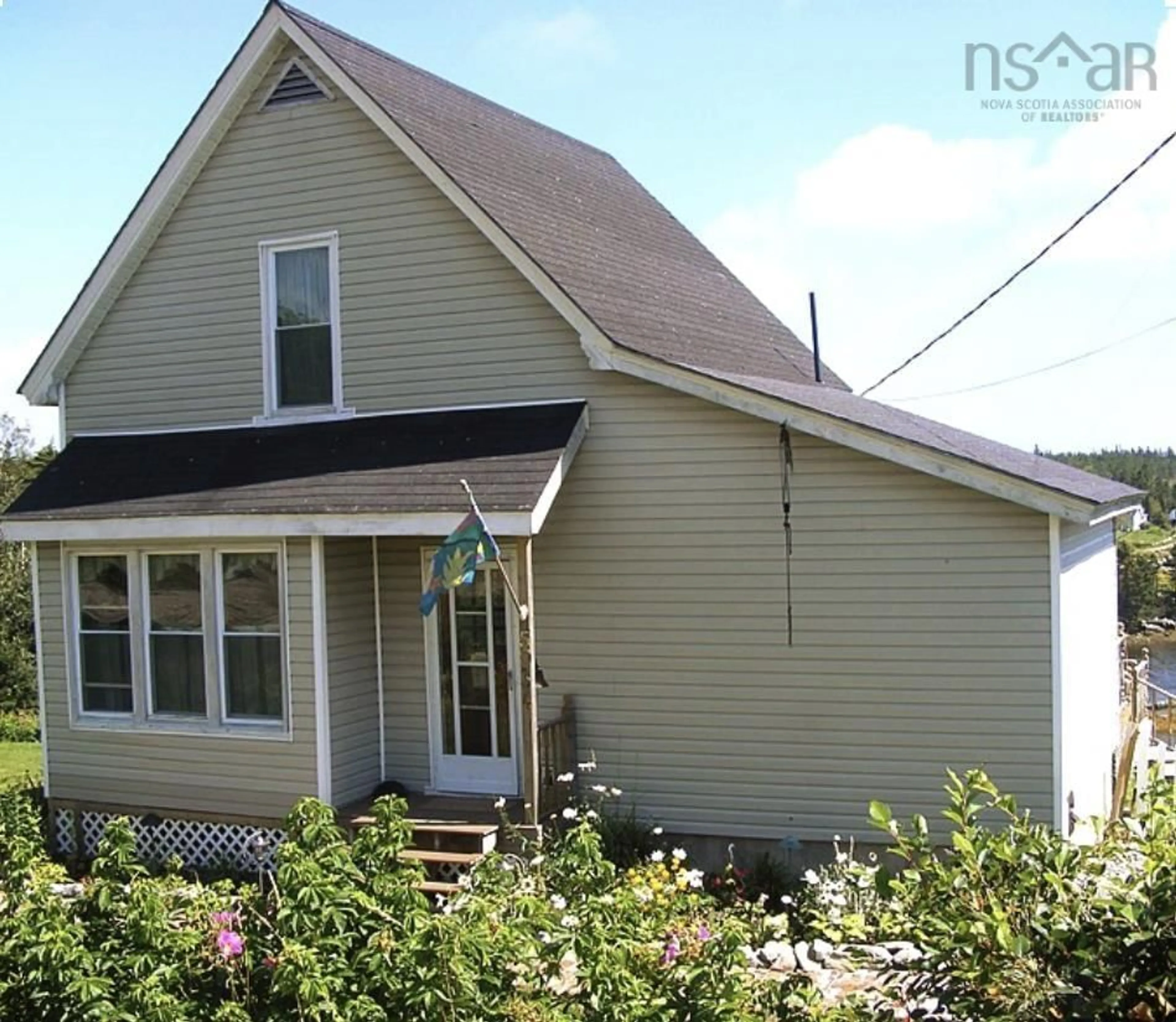Home with vinyl exterior material, street for 5034 Highway 7, Liscomb Nova Scotia B0J 2A0