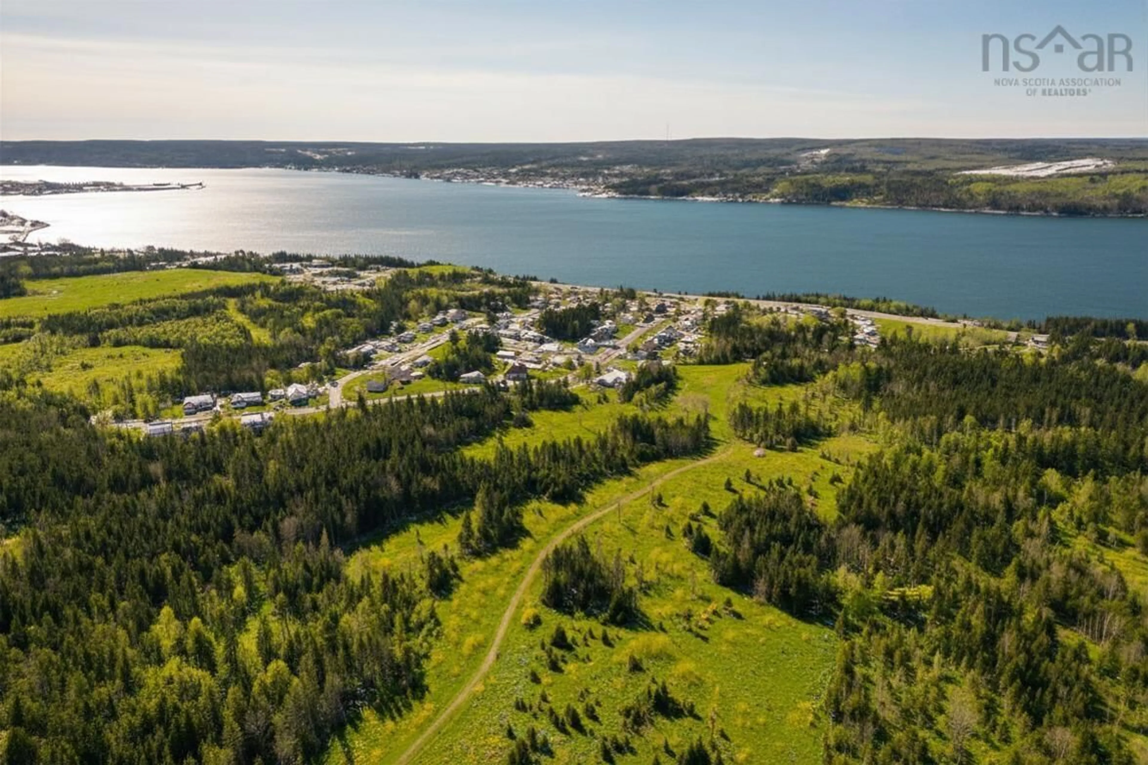 A pic from outside/outdoor area/front of a property/back of a property/a pic from drone, water/lake/river/ocean view for 61 Hilltop Dr, Port Hastings Nova Scotia B9A 1P2