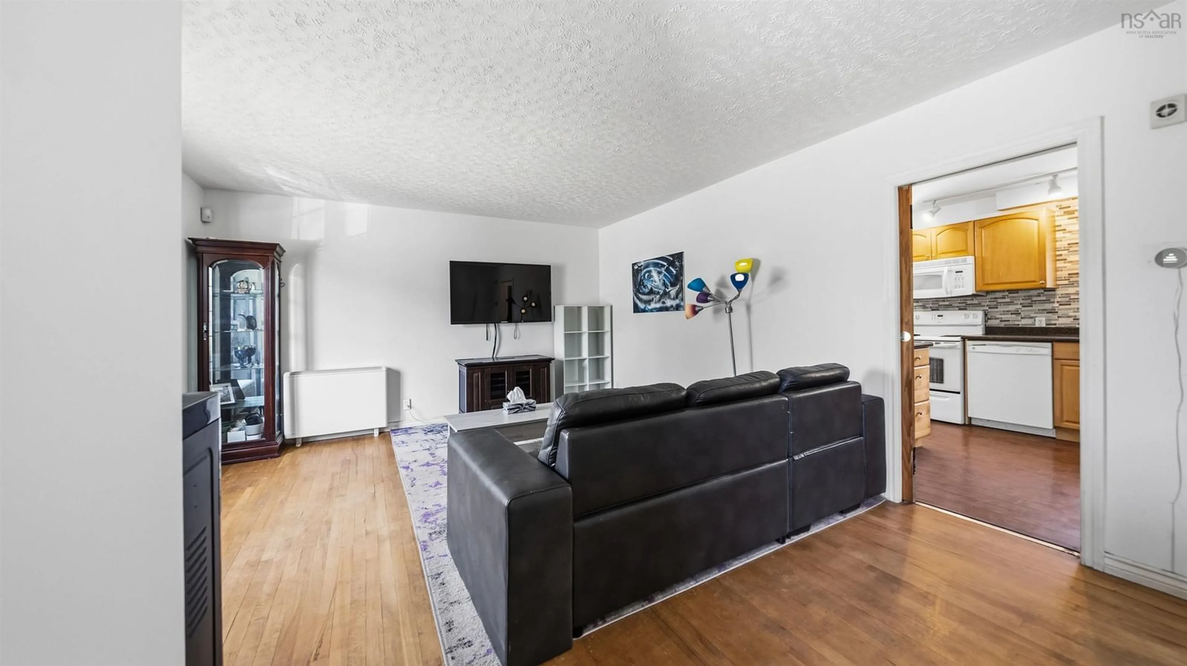 Living room with furniture, wood/laminate floor for 530 Spring Ave, Dartmouth Nova Scotia B2W 1X6