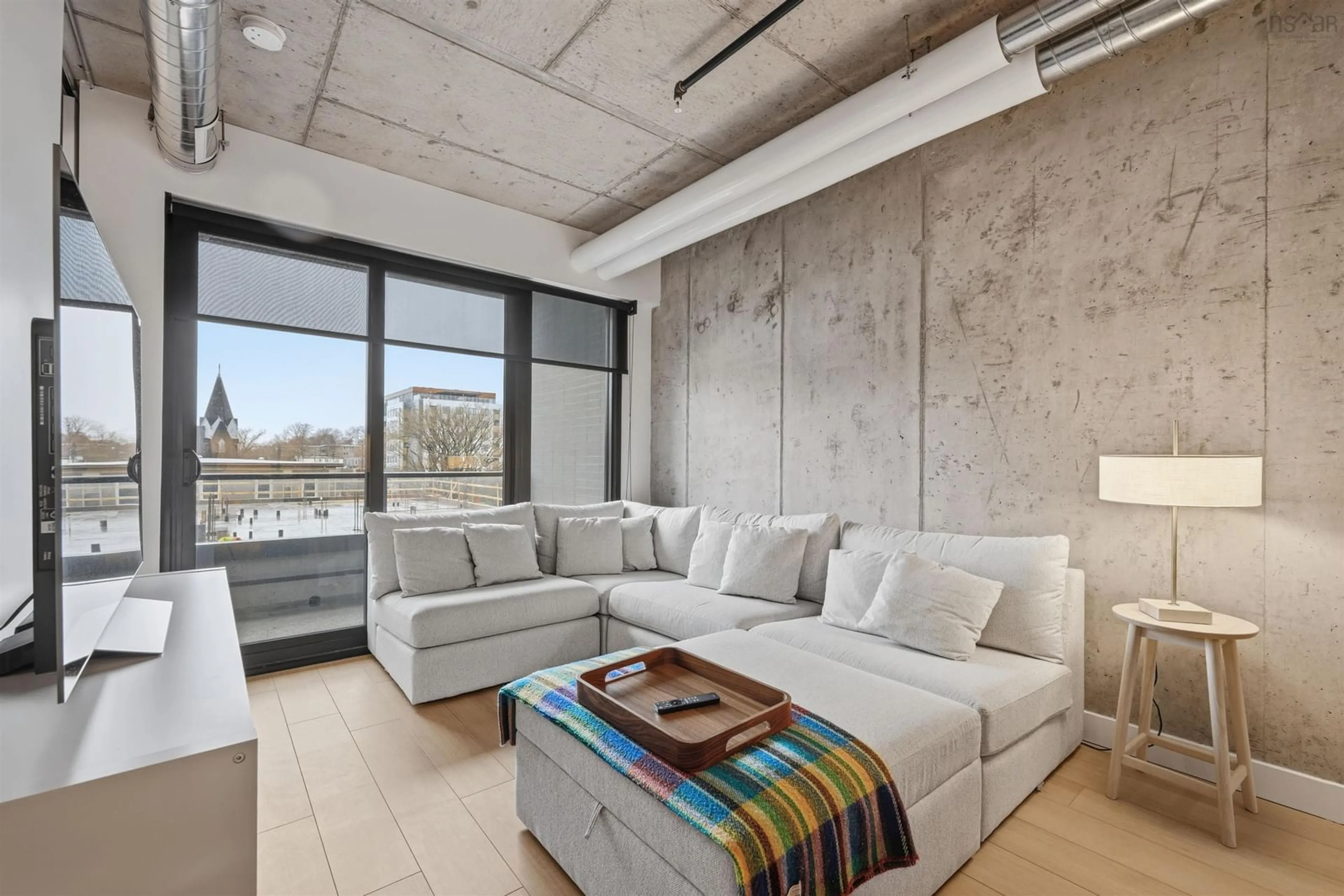 Living room with furniture, cement floor for 5511 Bilby St #409, Halifax Nova Scotia B3K 1V4