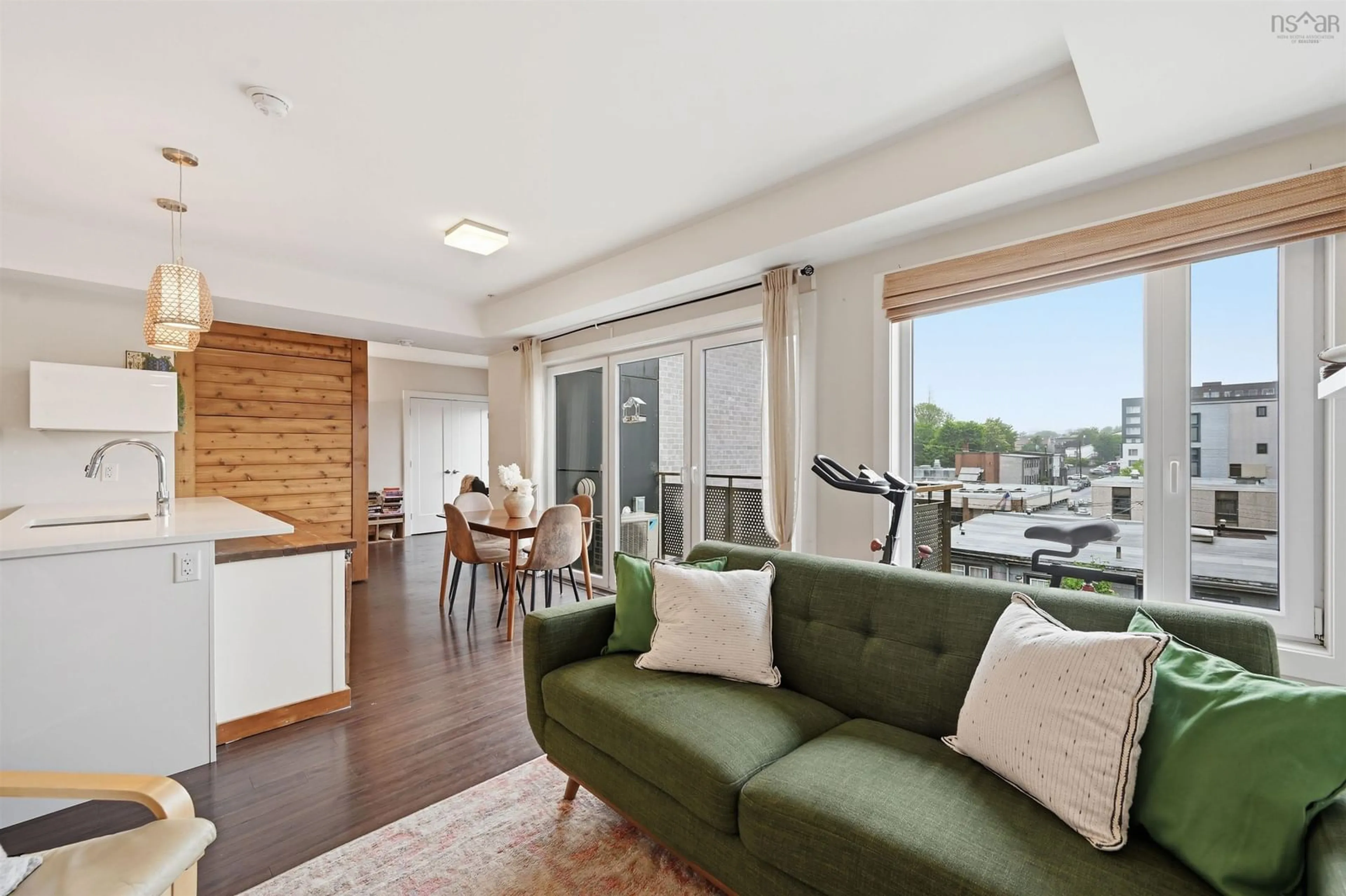 Living room with furniture, wood/laminate floor for 5677 Harris St #405, Halifax Nova Scotia B3K 0G4