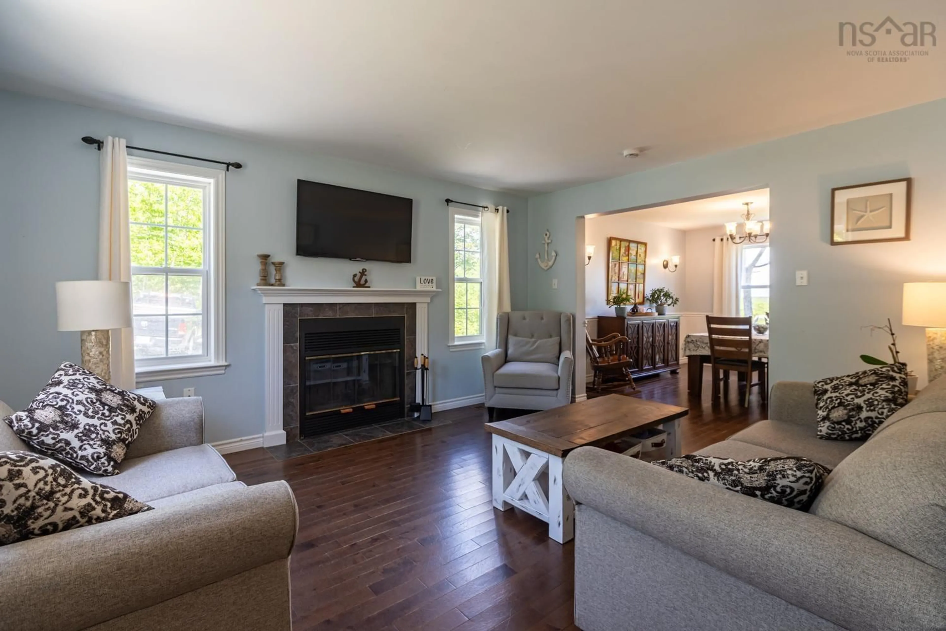 Living room with furniture, wood/laminate floor for 23 Macfarlane St, Lake Echo Nova Scotia B3E 1M5