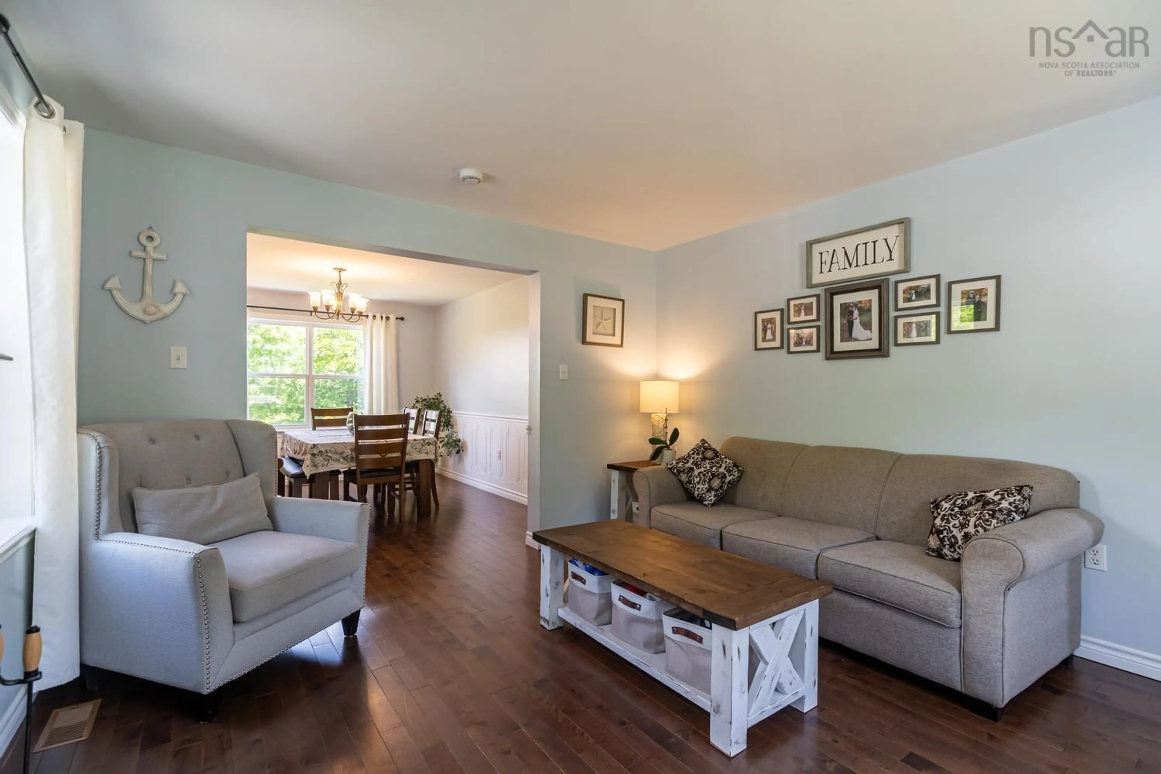 Living room with furniture, wood/laminate floor for 23 Macfarlane St, Lake Echo Nova Scotia B3E 1M5