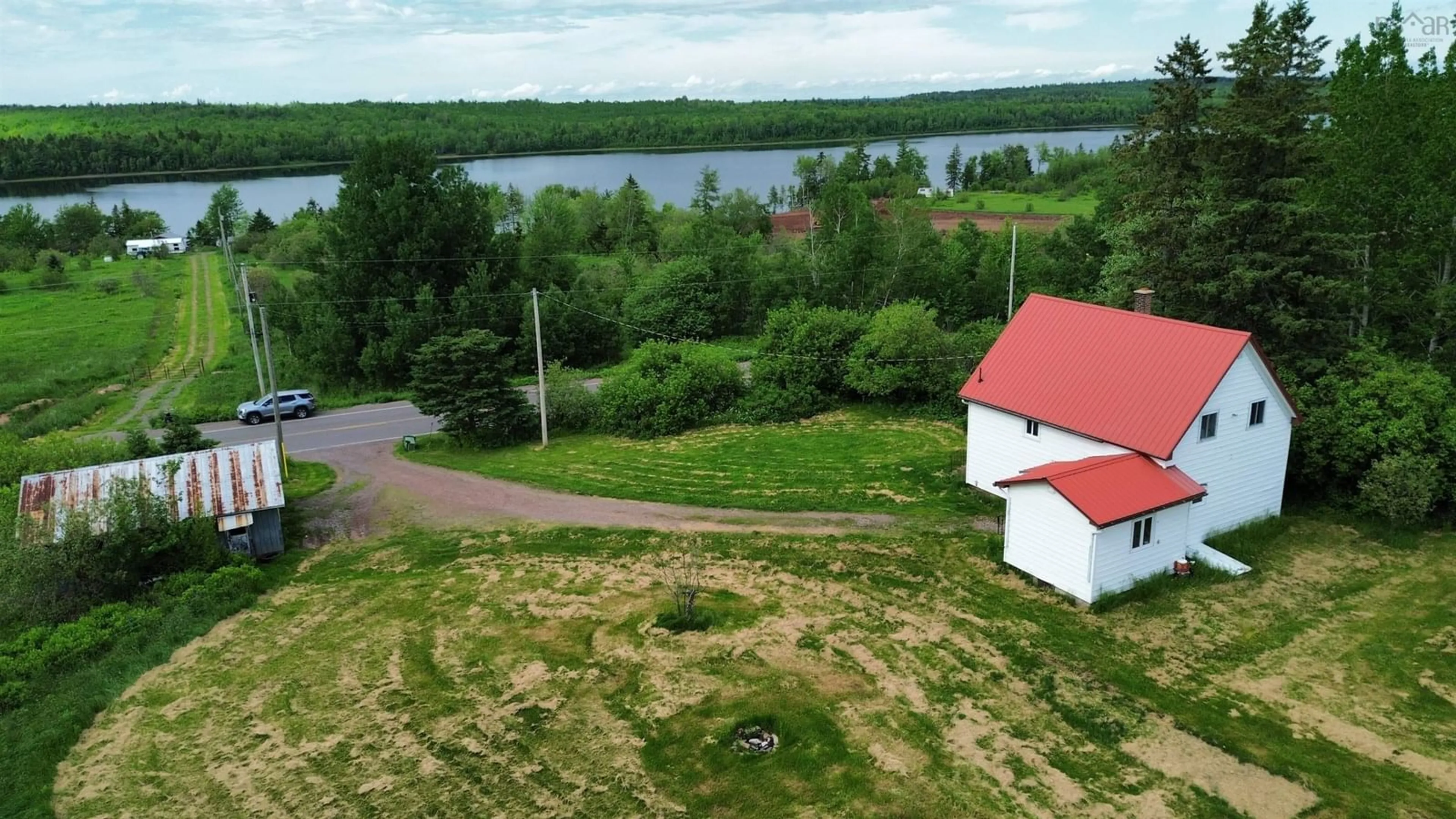 A pic from outside/outdoor area/front of a property/back of a property/a pic from drone, water/lake/river/ocean view for 9902 204 Hwy, South Victoria Nova Scotia B0M 1P0
