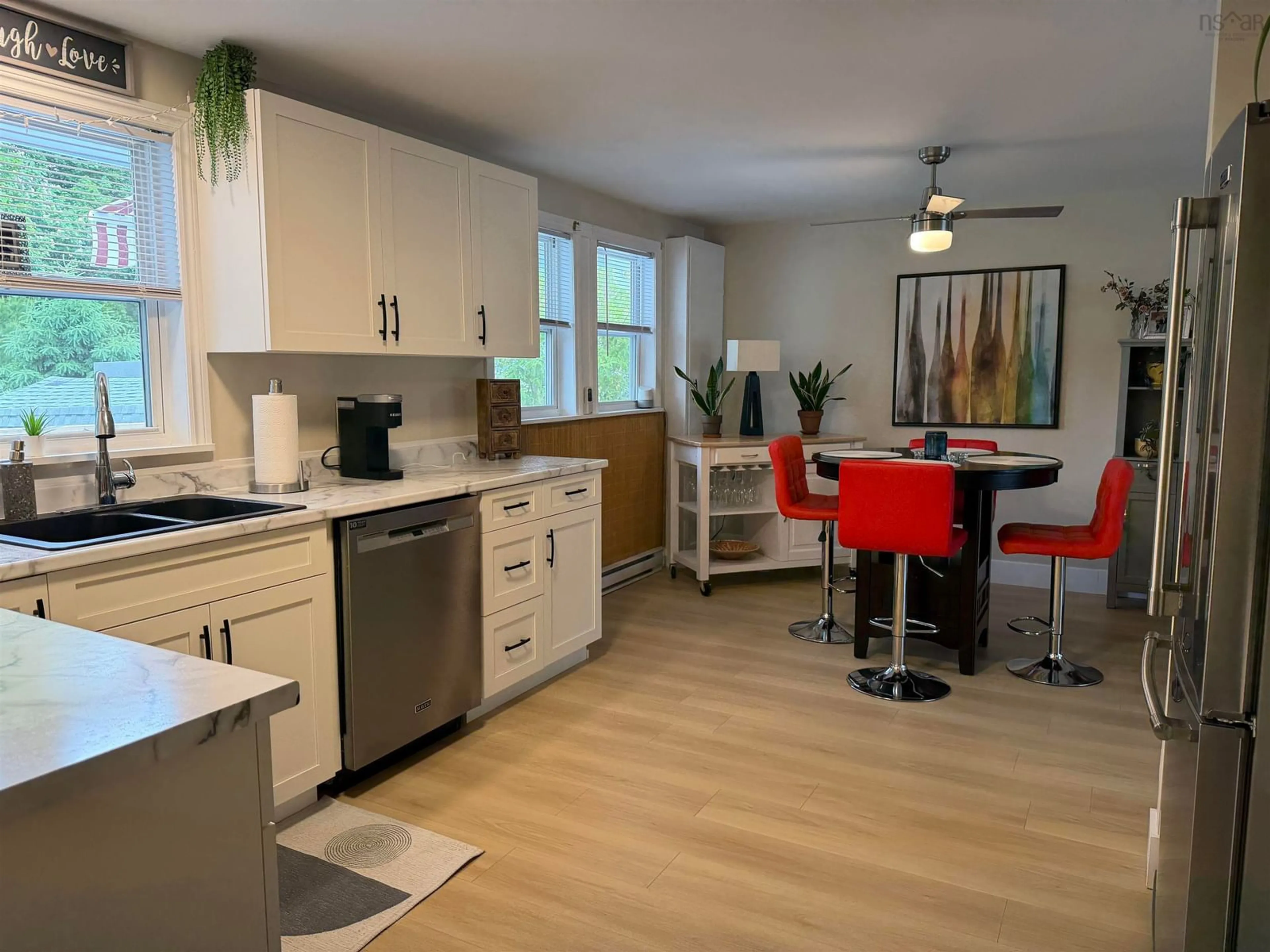 Open concept kitchen, wood/laminate floor for 27 Macintosh Ave, Bible Hill Nova Scotia B2N 4L5