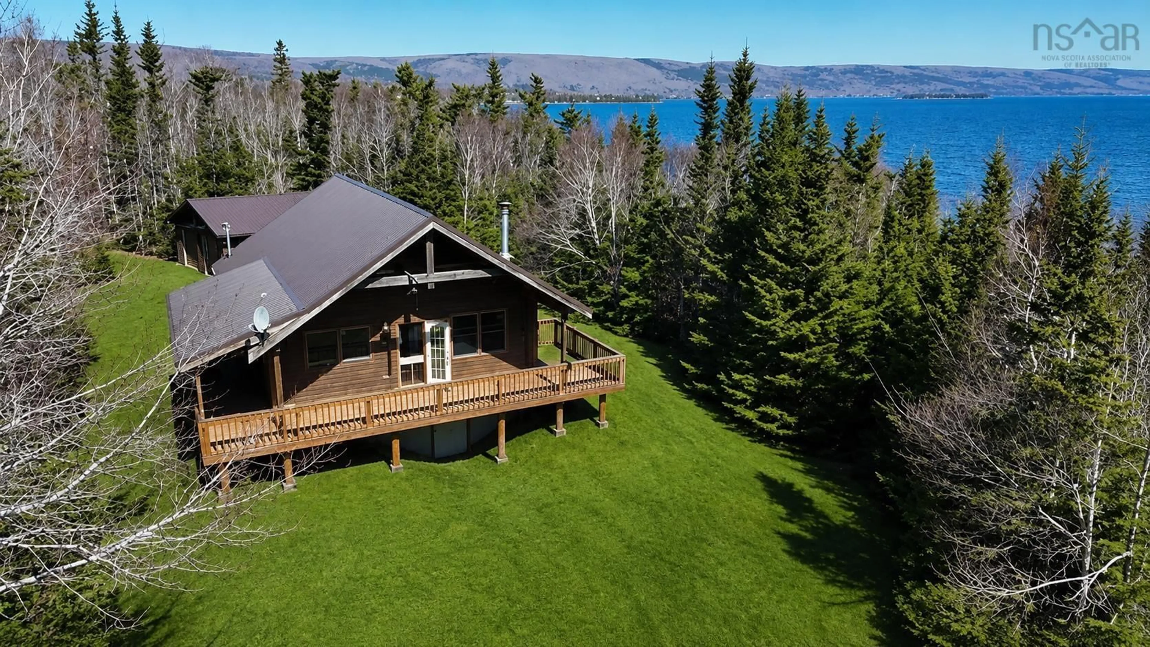A pic from outside/outdoor area/front of a property/back of a property/a pic from drone, water/lake/river/ocean view for 199 Spruce Point Rd, West Bay Marshes Nova Scotia B0E 3K0