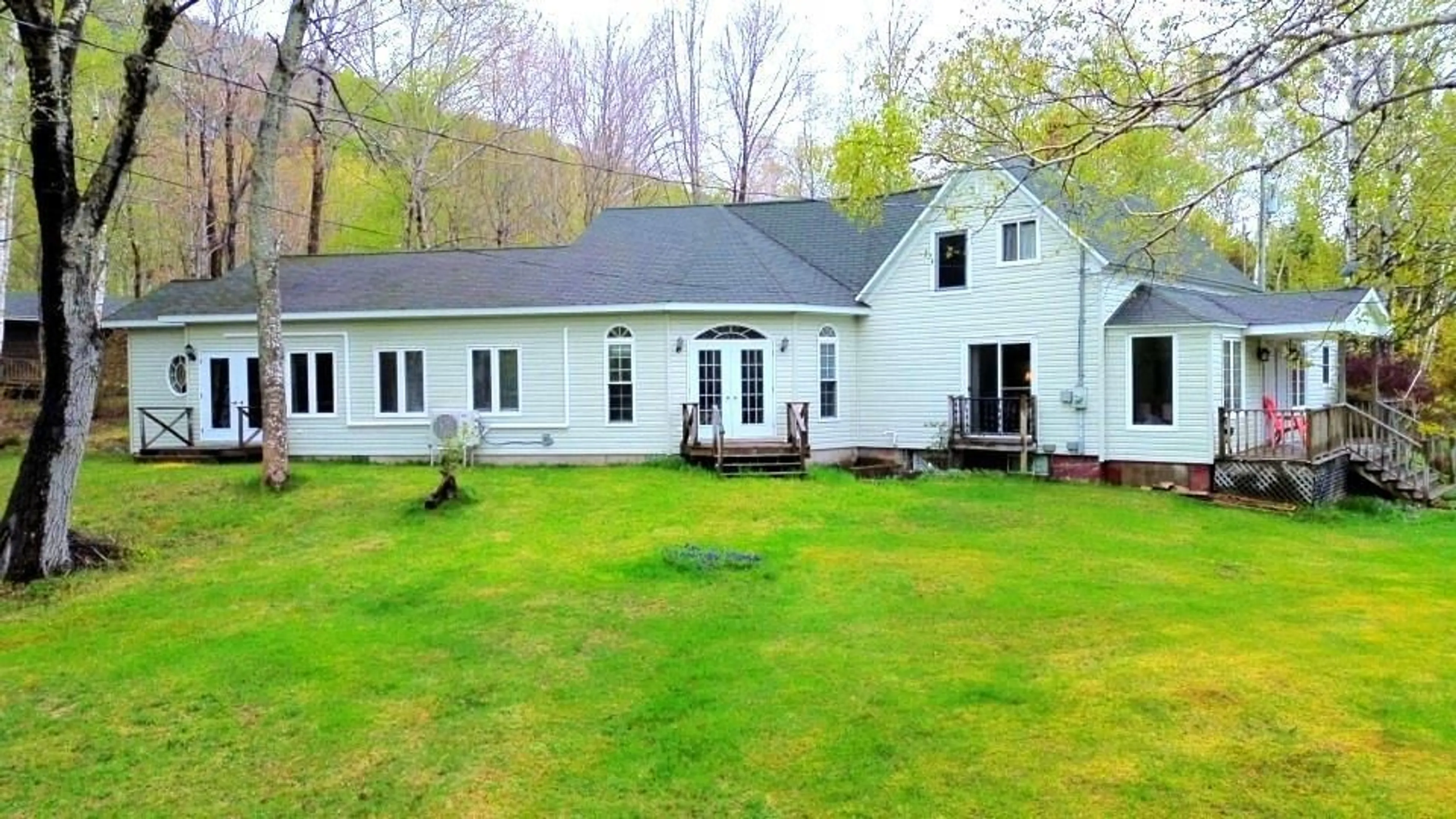A pic from outside/outdoor area/front of a property/back of a property/a pic from drone, water/lake/river/ocean view for 45478 Cabot Trail, Indian Brook Nova Scotia B0C 1H0