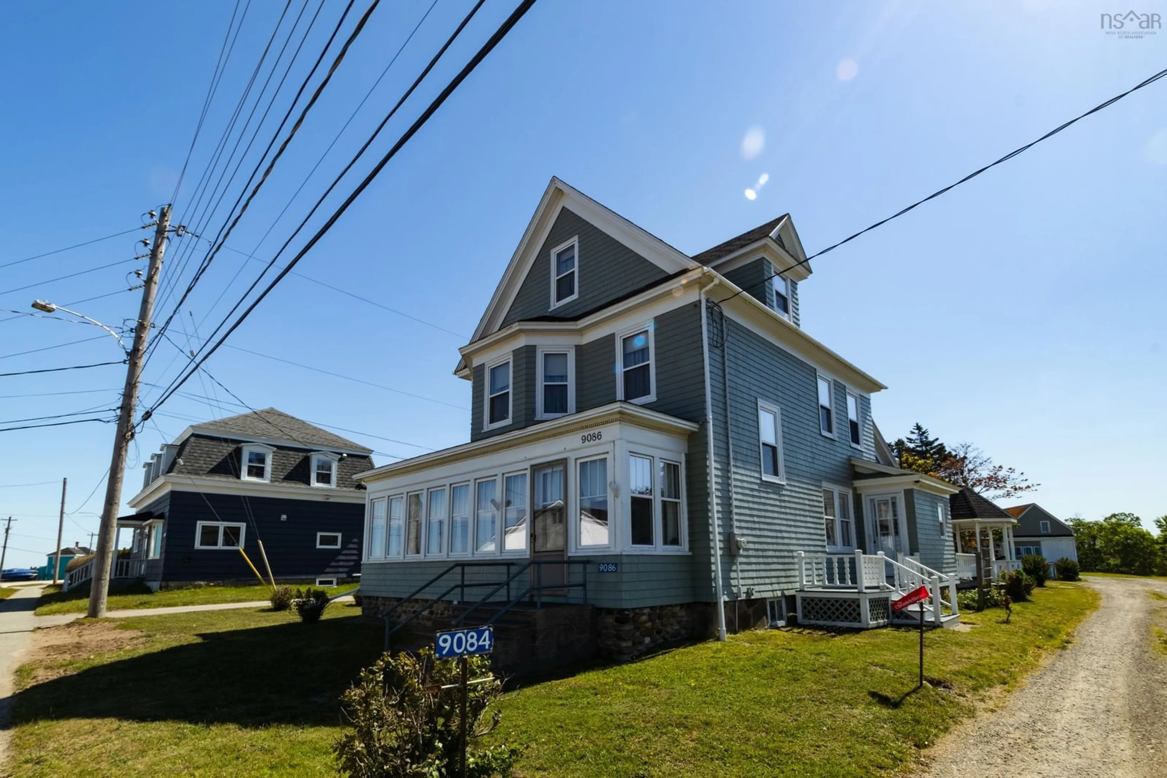 Home with vinyl exterior material, street for 9086 Highway 1, Meteghan River Nova Scotia B0W 2L0