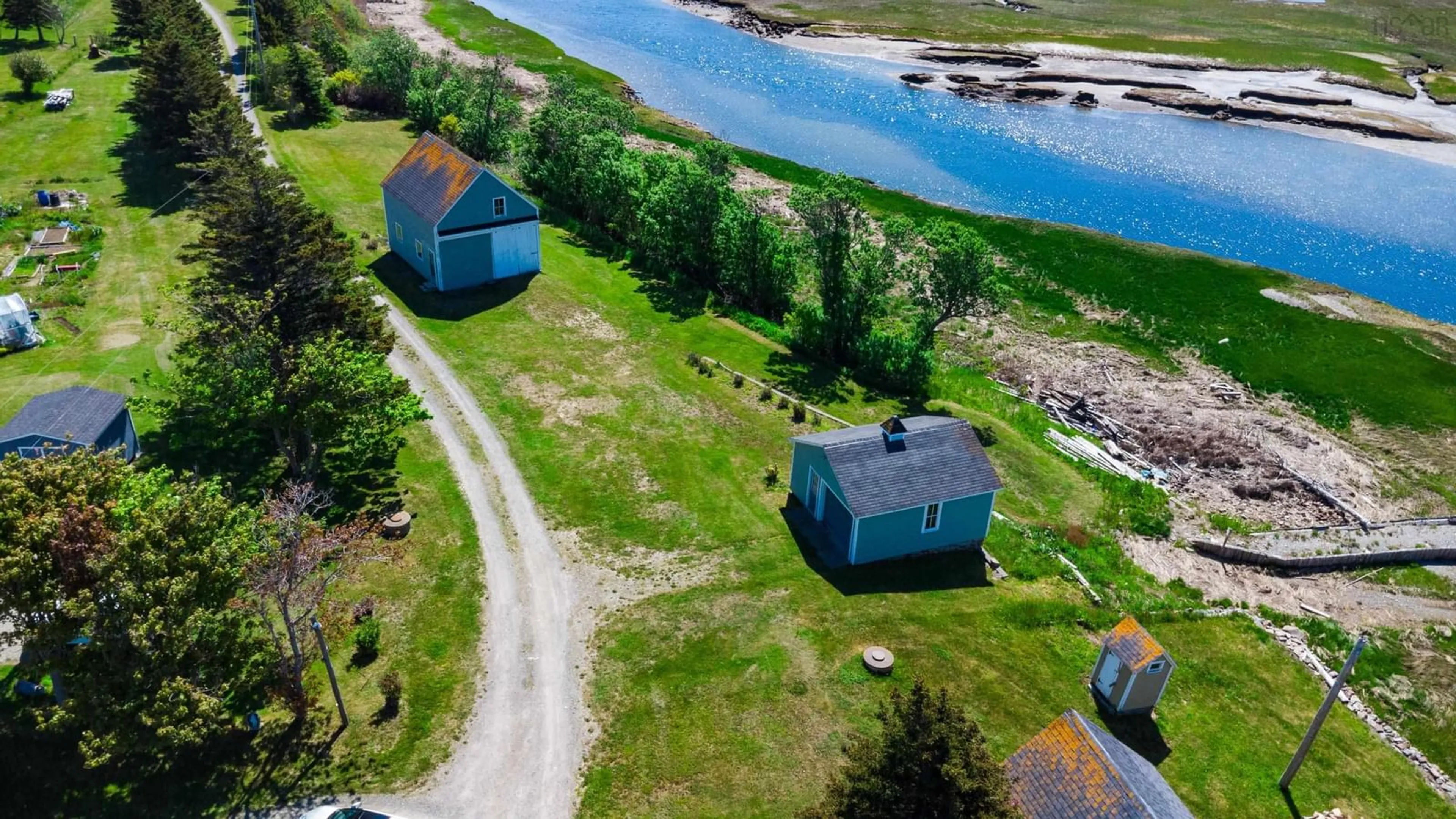 A pic from outside/outdoor area/front of a property/back of a property/a pic from drone, water/lake/river/ocean view for 9086 Highway 1, Meteghan River Nova Scotia B0W 2L0