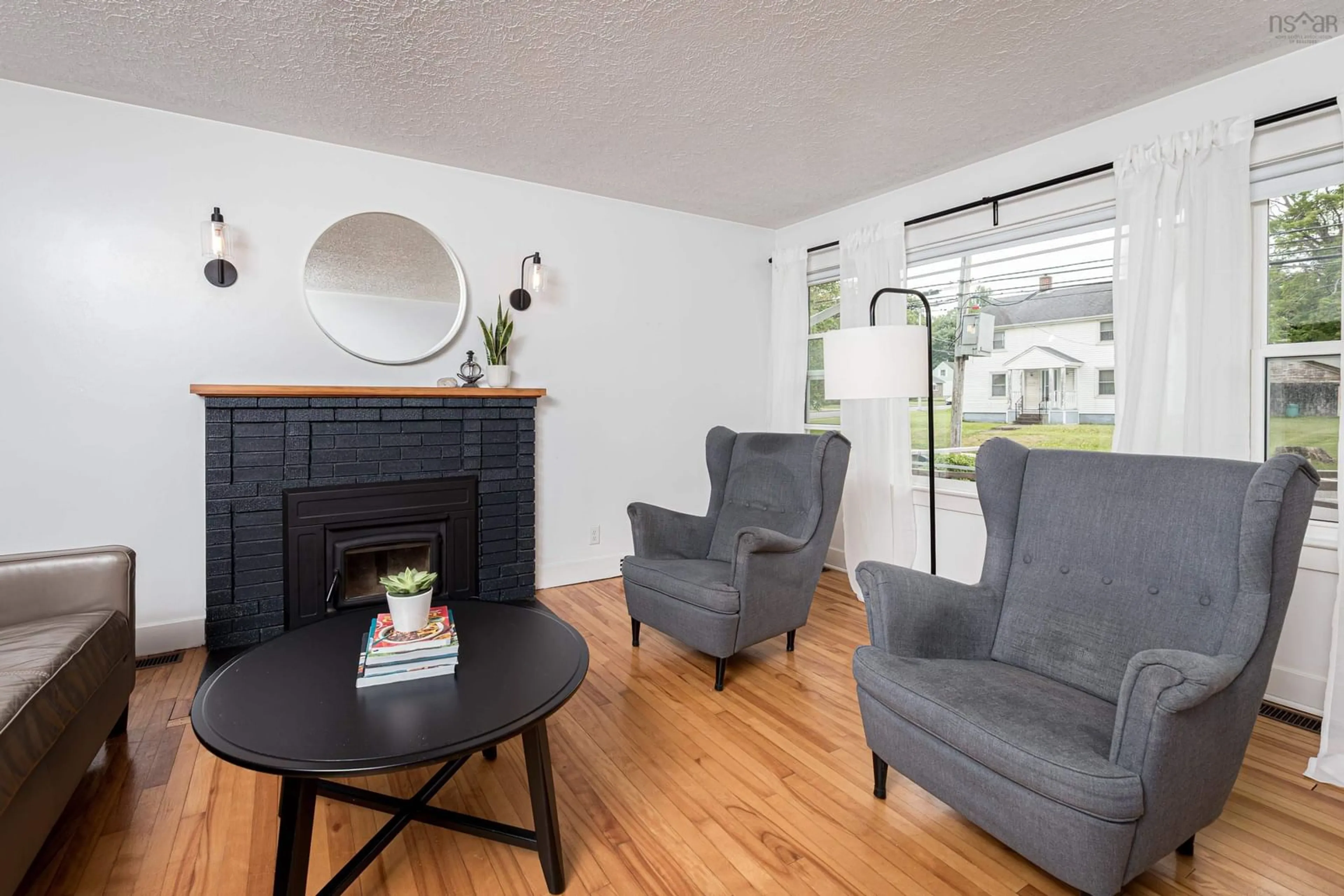 Living room with furniture, wood/laminate floor for 319 Brunswick St, Truro Nova Scotia B2N 2J4