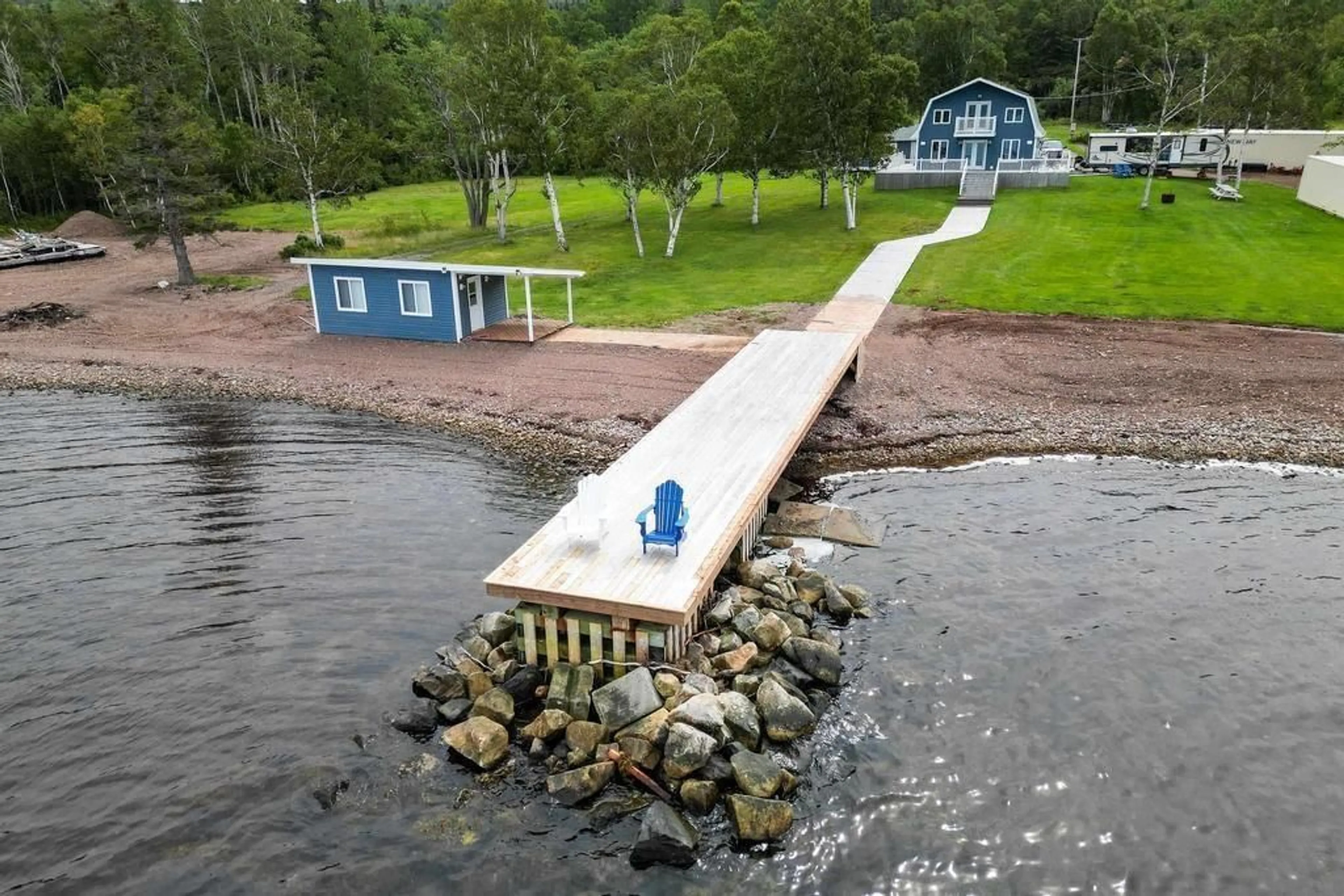 A pic from outside/outdoor area/front of a property/back of a property/a pic from drone, water/lake/river/ocean view for 3280 Grand Narrows Hwy, Boisdale Nova Scotia B1Y 3R5