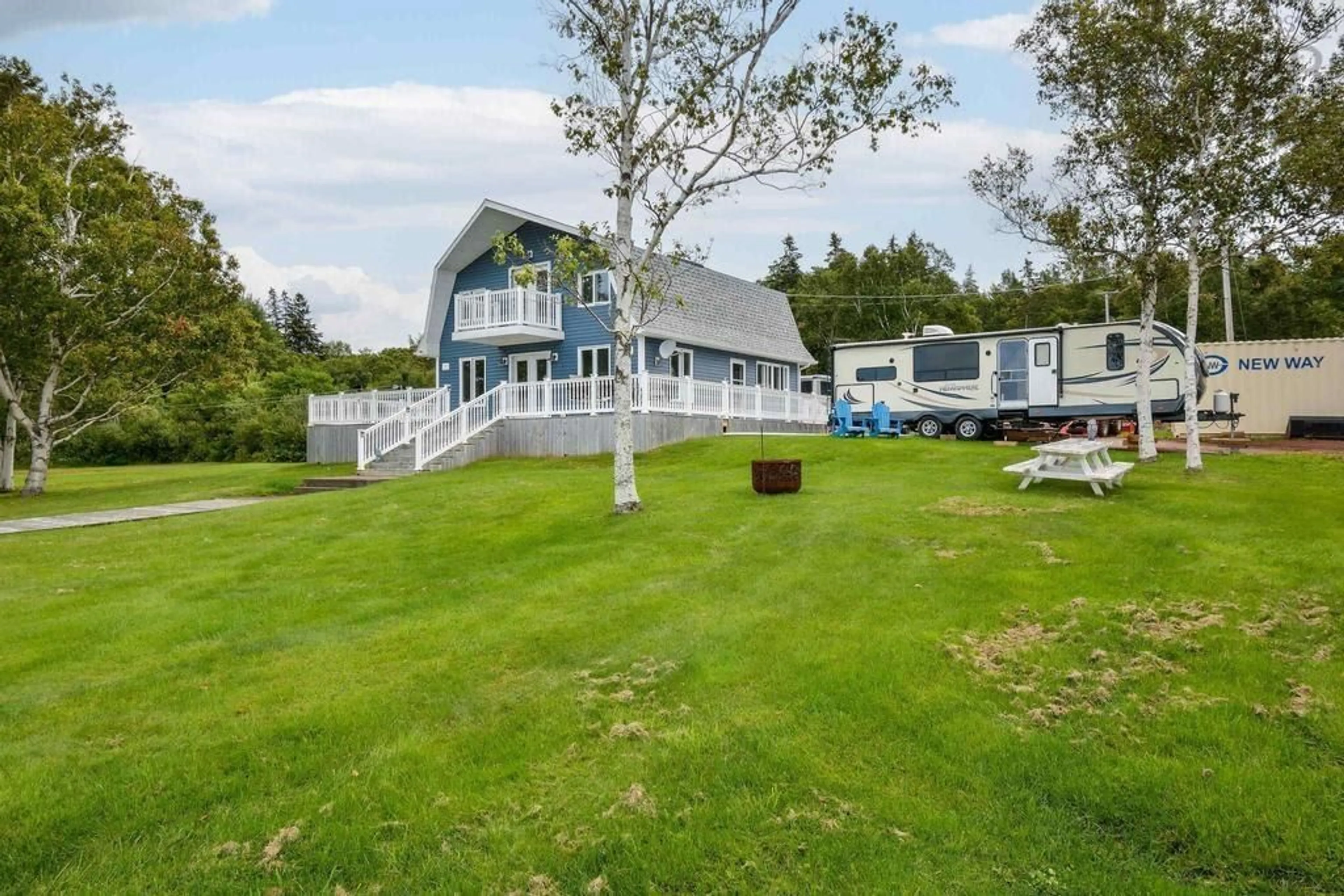 A pic from outside/outdoor area/front of a property/back of a property/a pic from drone, water/lake/river/ocean view for 3280 Grand Narrows Hwy, Boisdale Nova Scotia B1Y 3R5