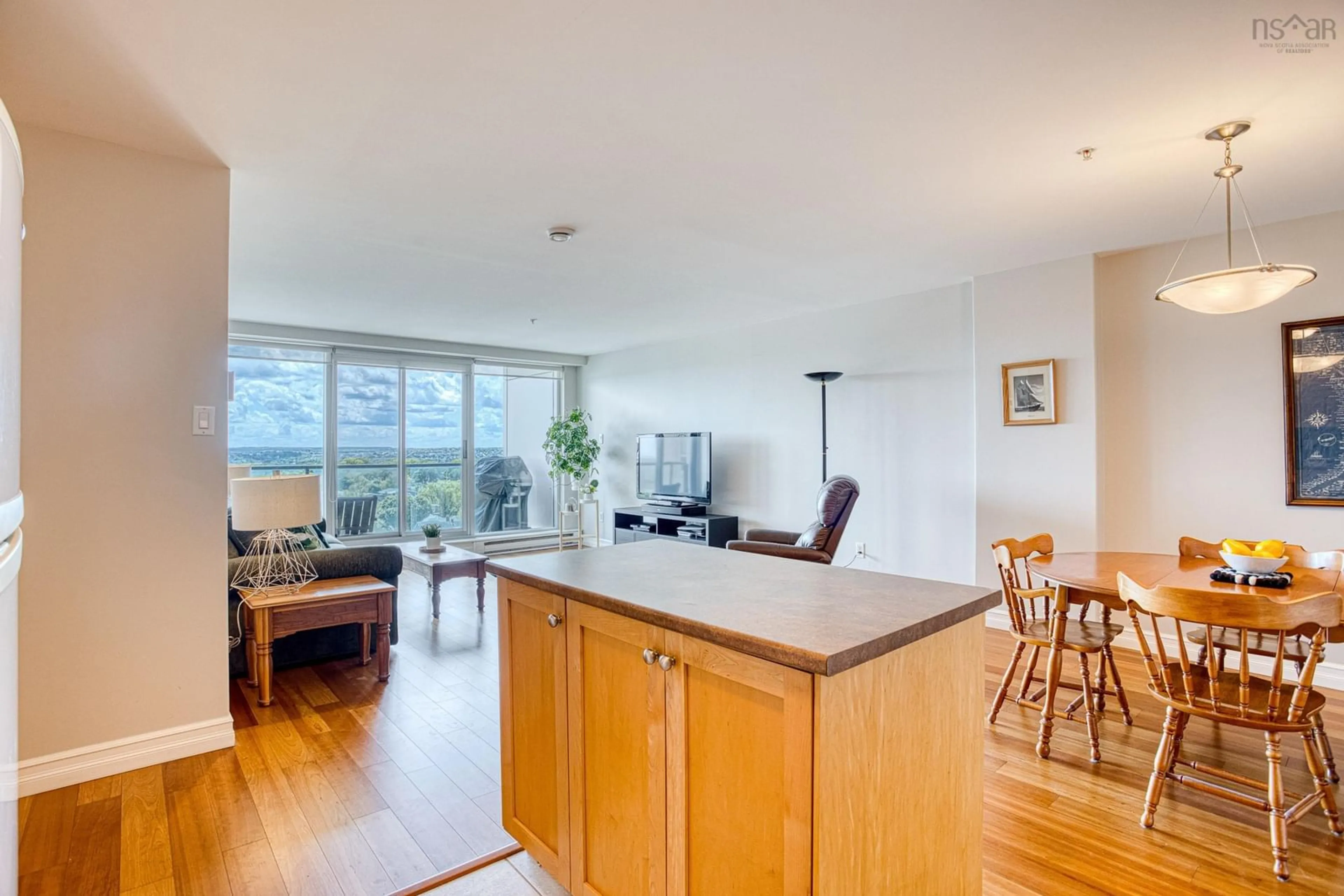 Open concept kitchen, wood/laminate floor for 2677 Gladstone St #1104, Halifax Nova Scotia B3K 0A3