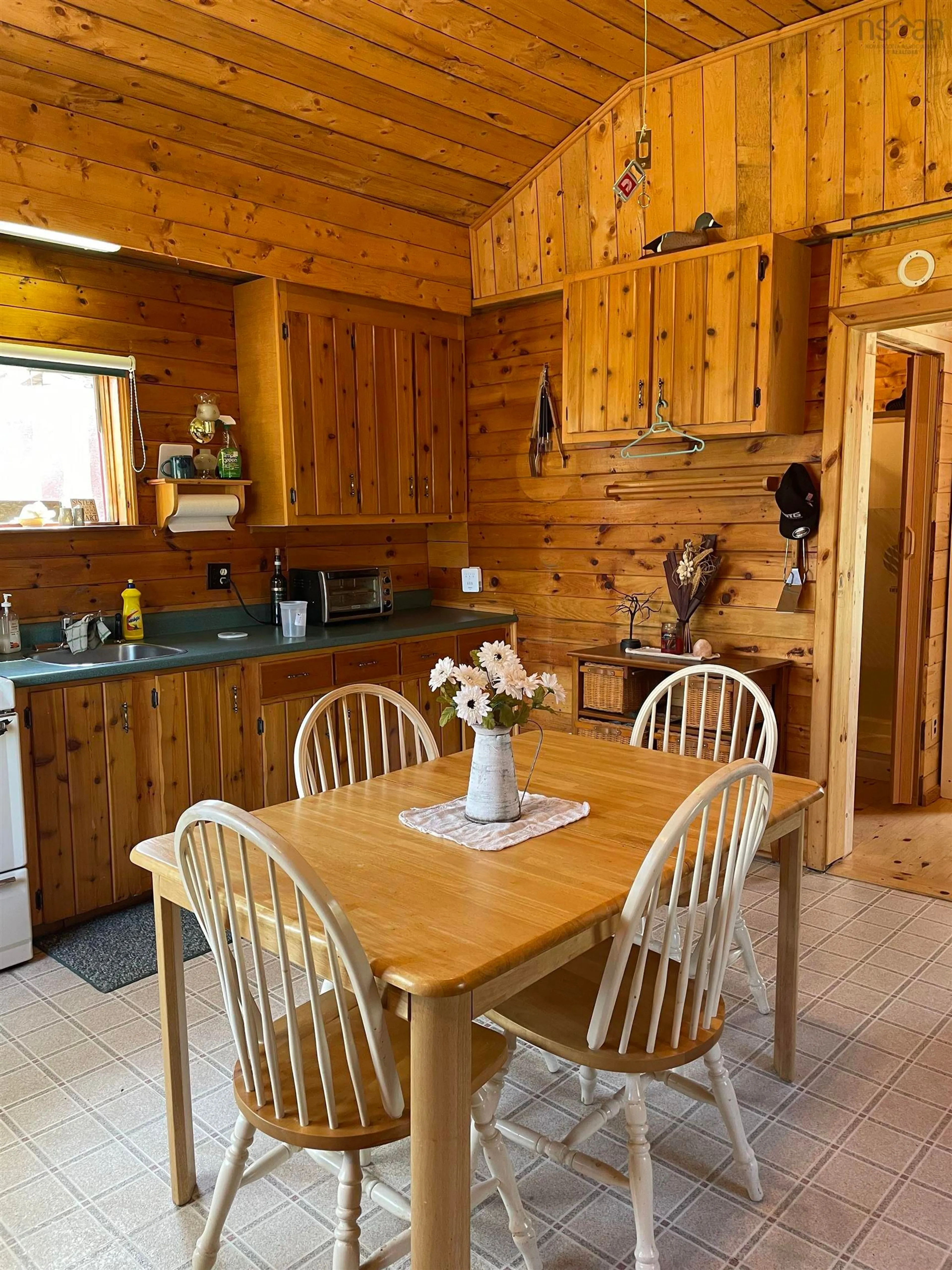 Dining room, wood/laminate floor for 25 Ton Timber Hills Rd, Moser River Nova Scotia B0J 2R0