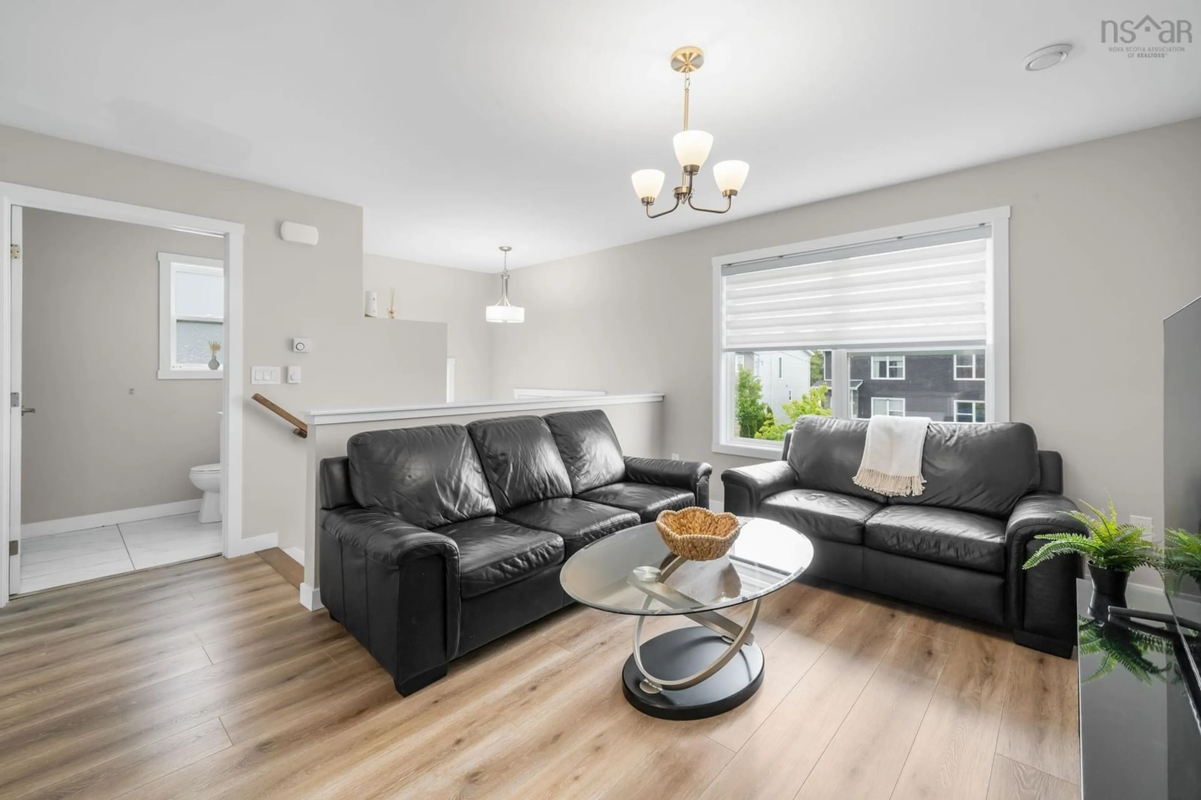 Living room with furniture, wood/laminate floor for 114 Cortland Ridge, Spryfield Nova Scotia B3R 0G6