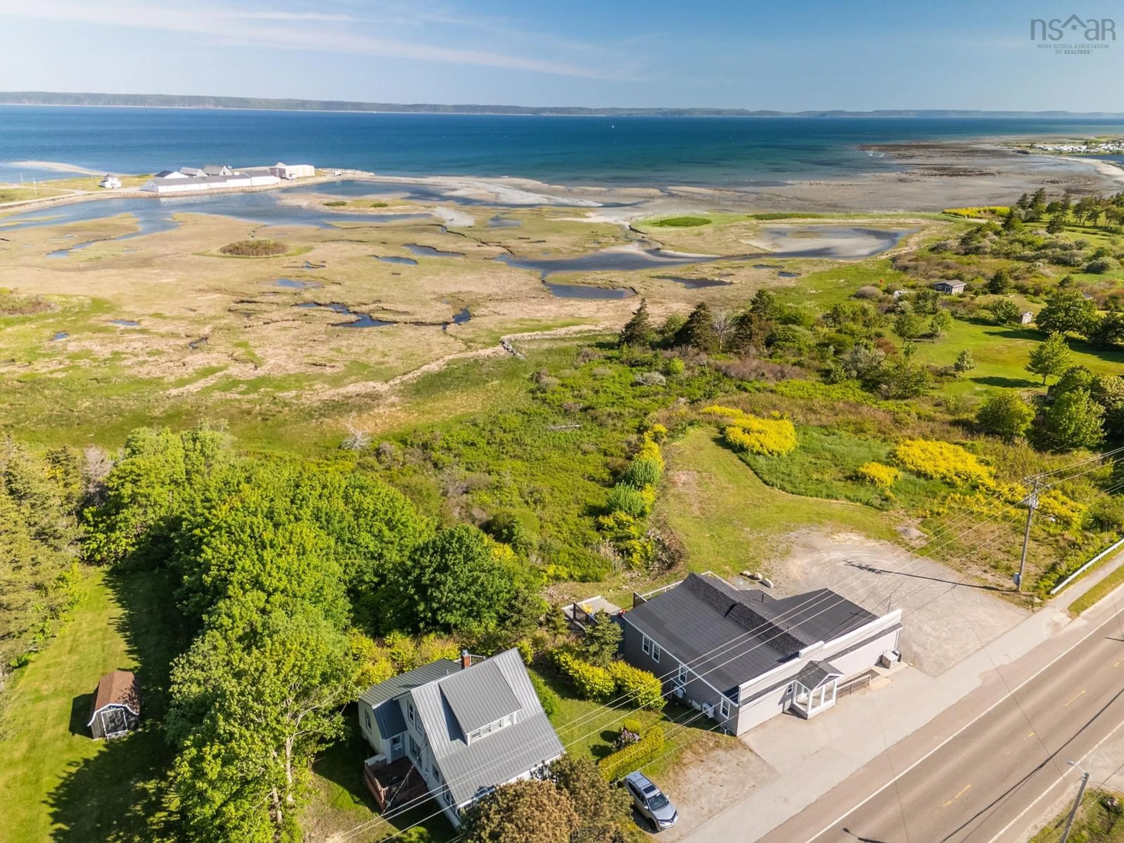 A pic from outside/outdoor area/front of a property/back of a property/a pic from drone, water/lake/river/ocean view for 1861 Highway 1, Church Point Nova Scotia B0W 1M0