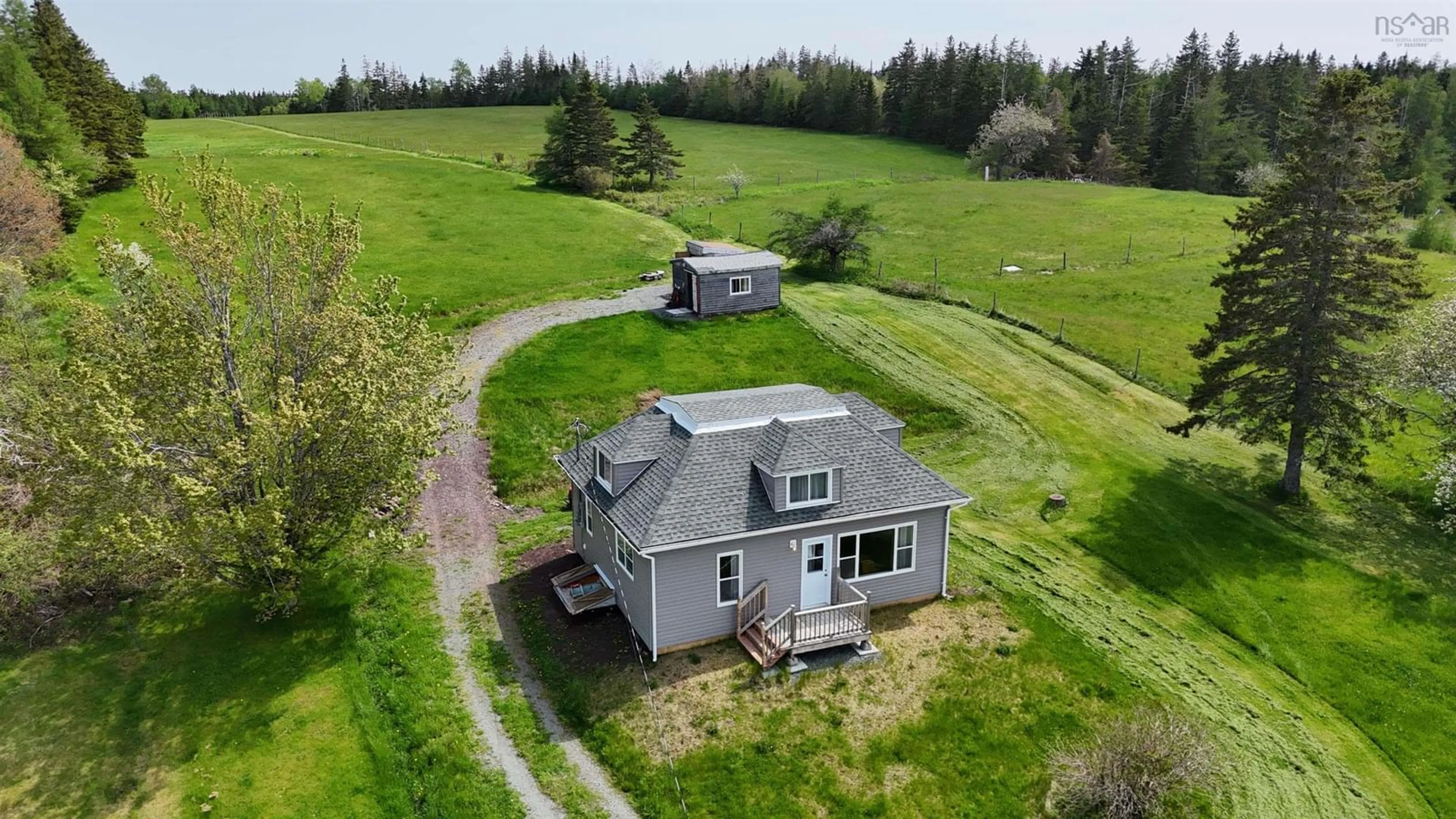 A pic from outside/outdoor area/front of a property/back of a property/a pic from drone, building for 50 Riverview Dr, River Bourgeois Nova Scotia B0E 2X0