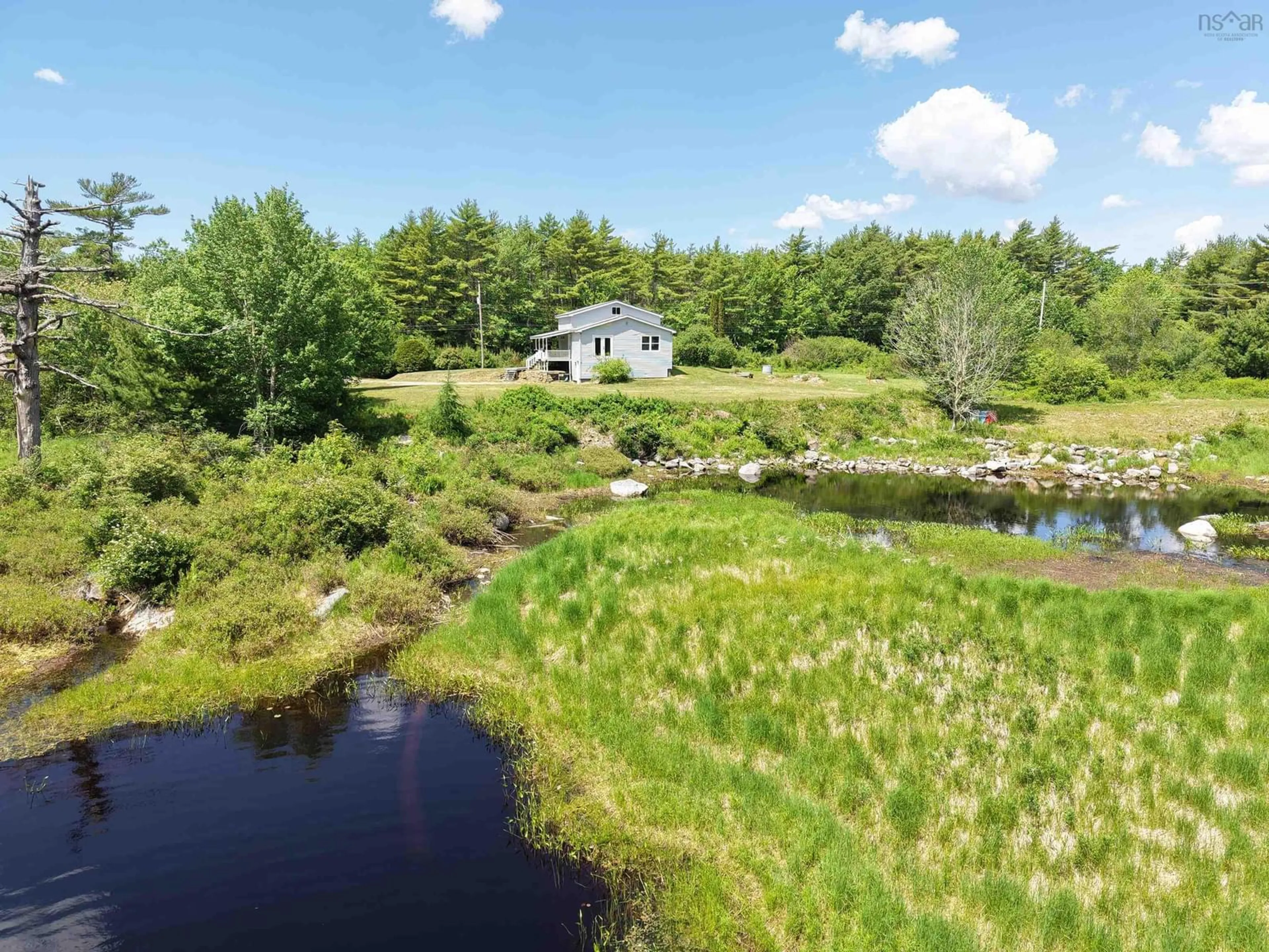 A pic from outside/outdoor area/front of a property/back of a property/a pic from drone, water/lake/river/ocean view for 4184 203 Hwy, Middle Ohio Nova Scotia B0T 1W0