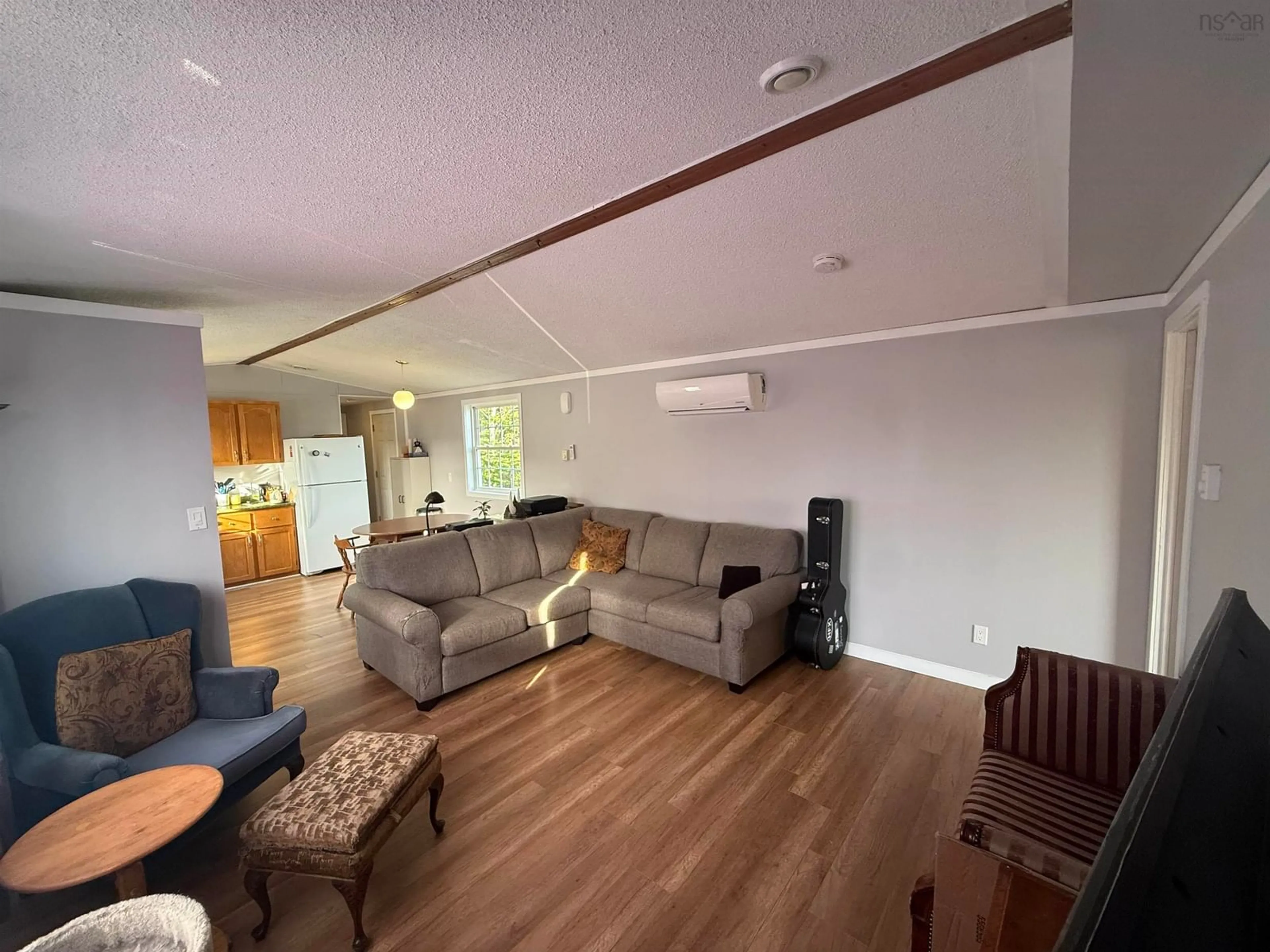 Living room with furniture, wood/laminate floor for 10 Park St, Howie Centre Nova Scotia B1L 1C9